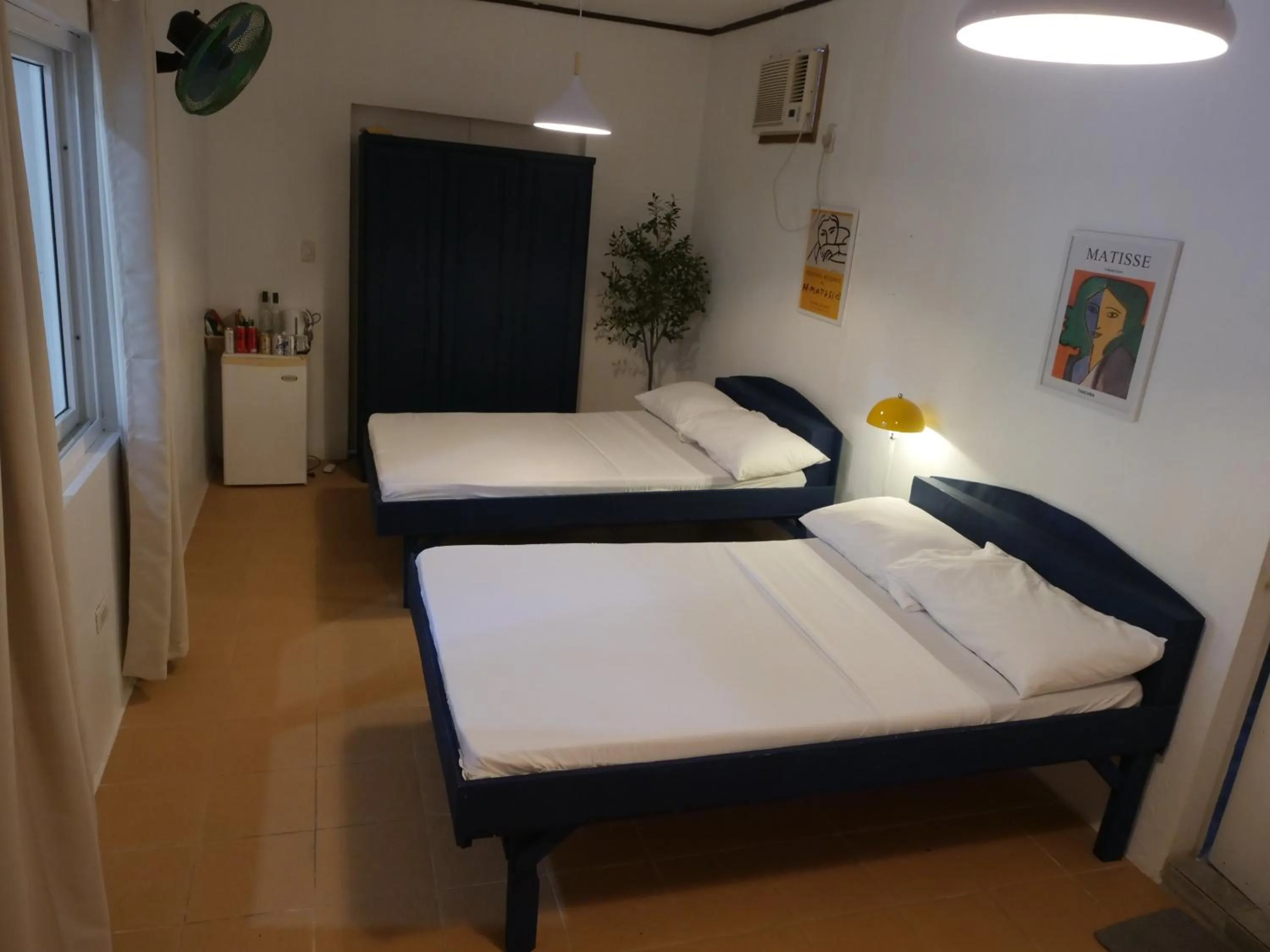 Bed in The Shark's Tail Dive Resort