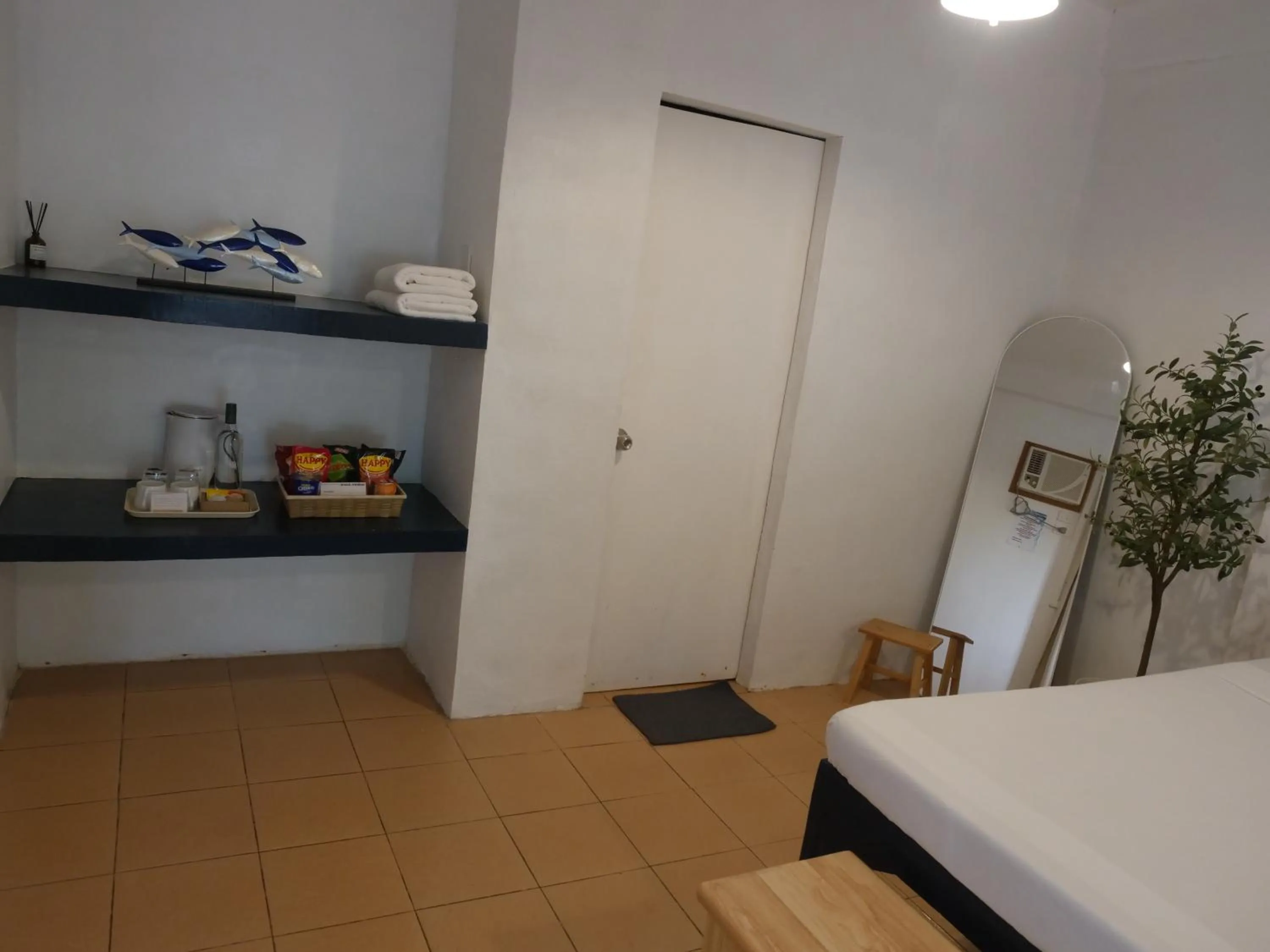 Bed in The Shark's Tail Dive Resort