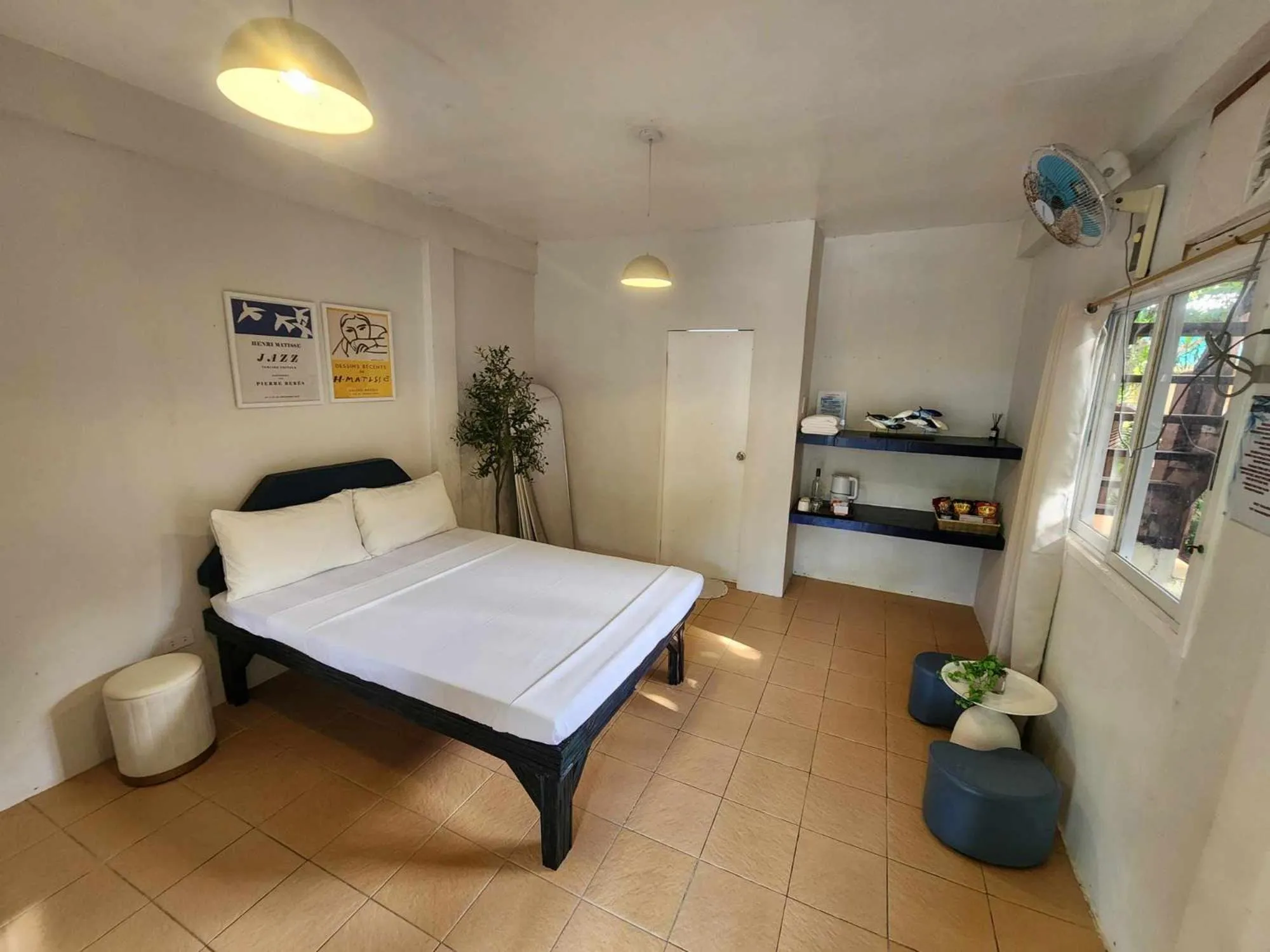 Bed in The Shark's Tail Dive Resort