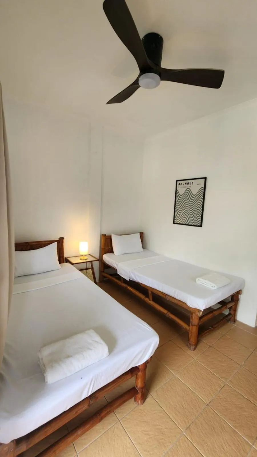 Bed in The Shark's Tail Dive Resort