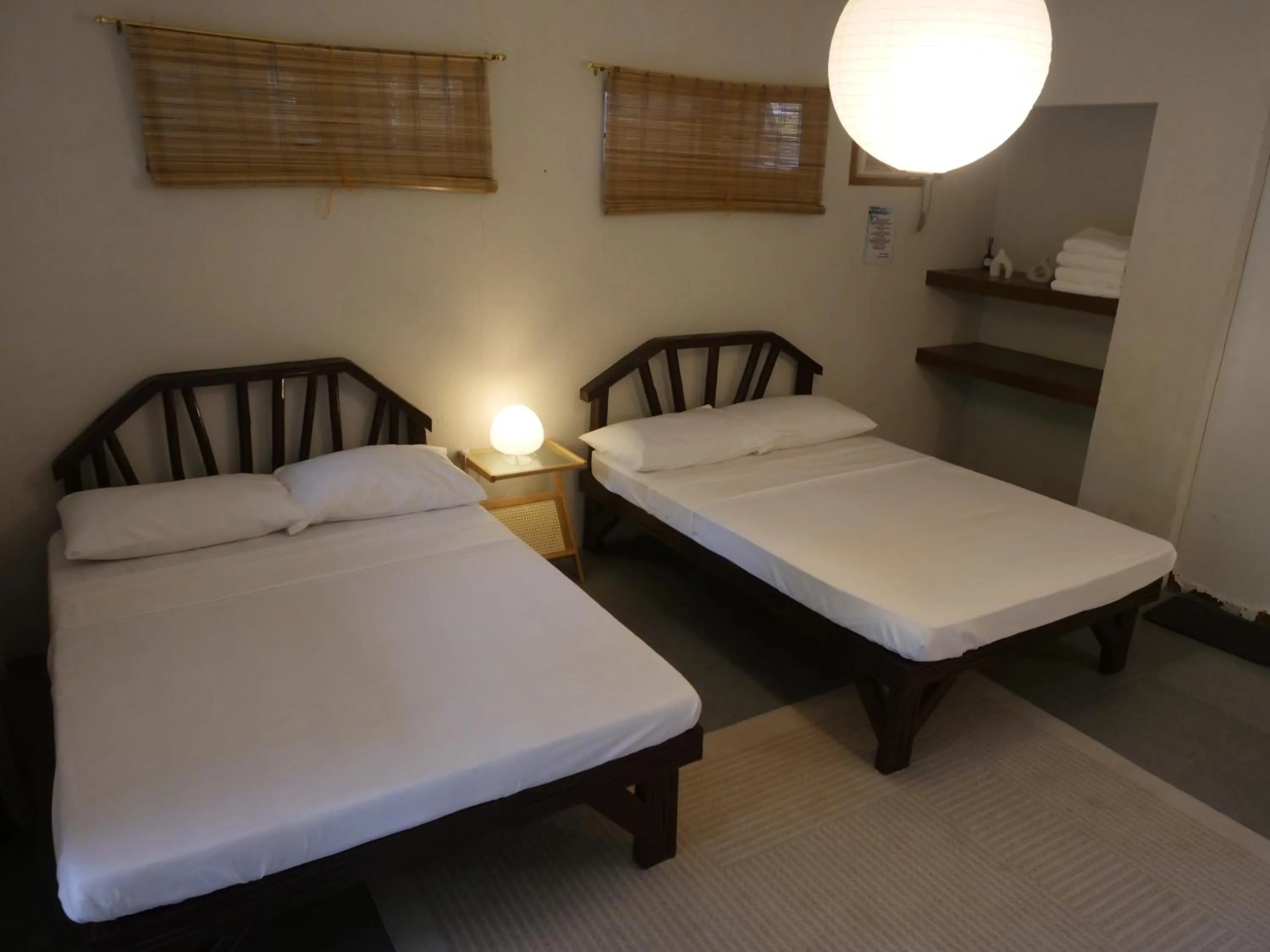 Bed in The Shark's Tail Dive Resort