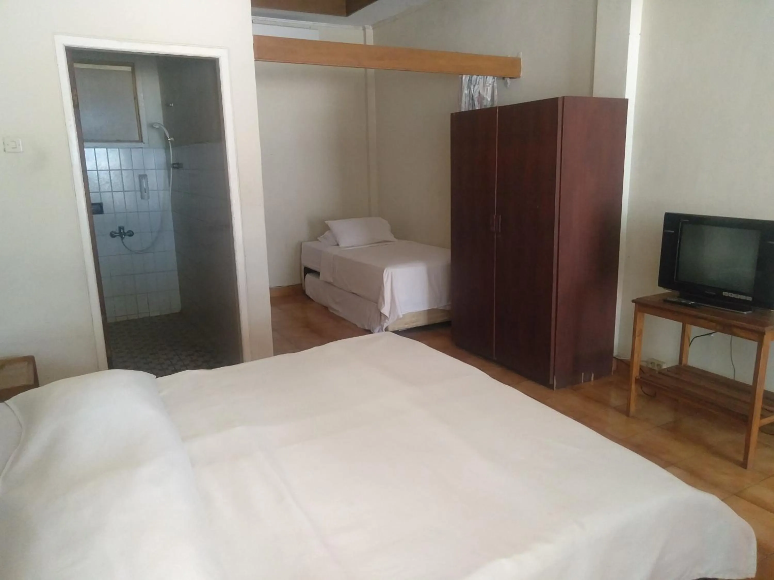 Bed in Bunga Ayu Seaside Resort