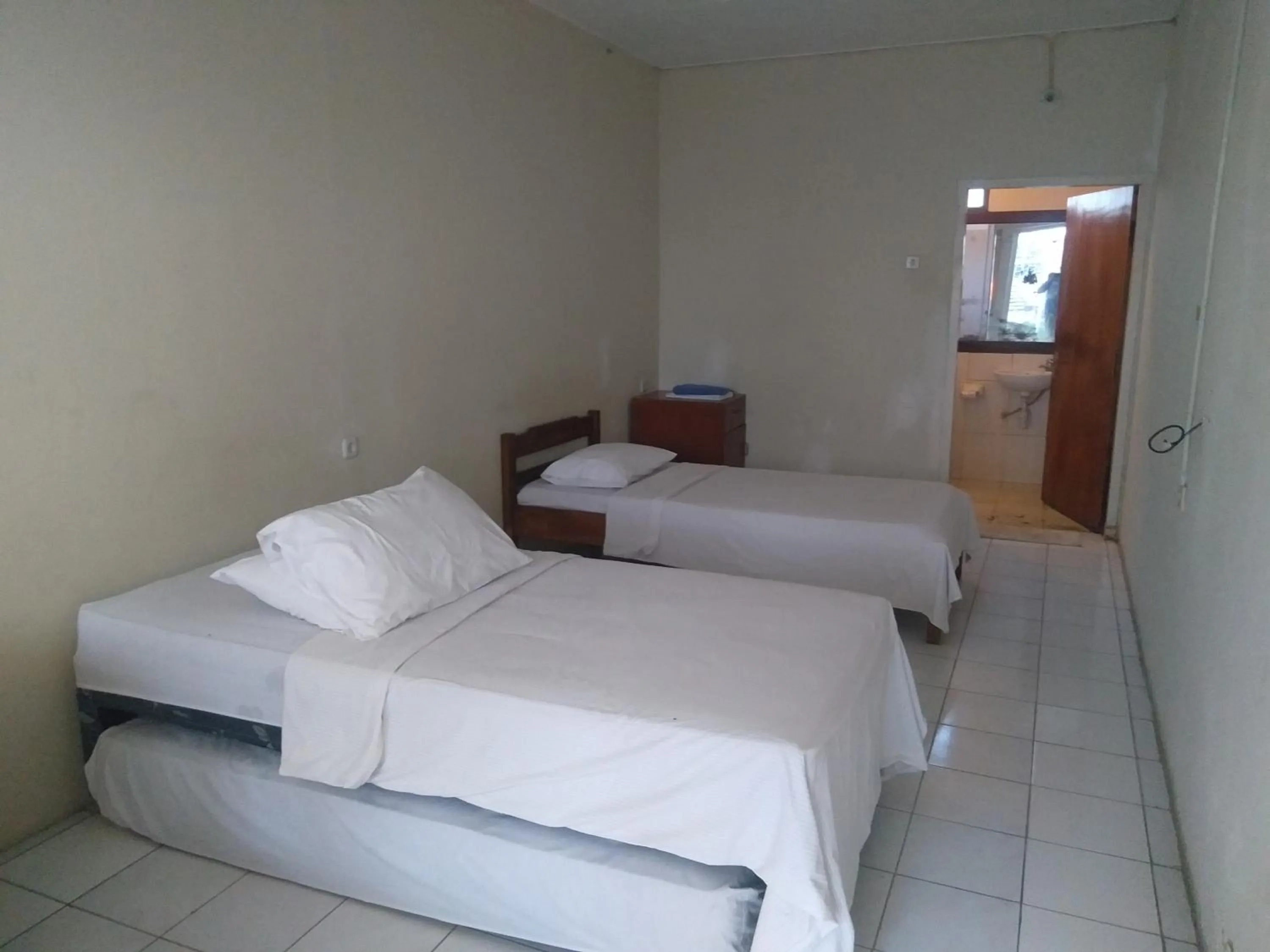 Bed in Bunga Ayu Seaside Resort