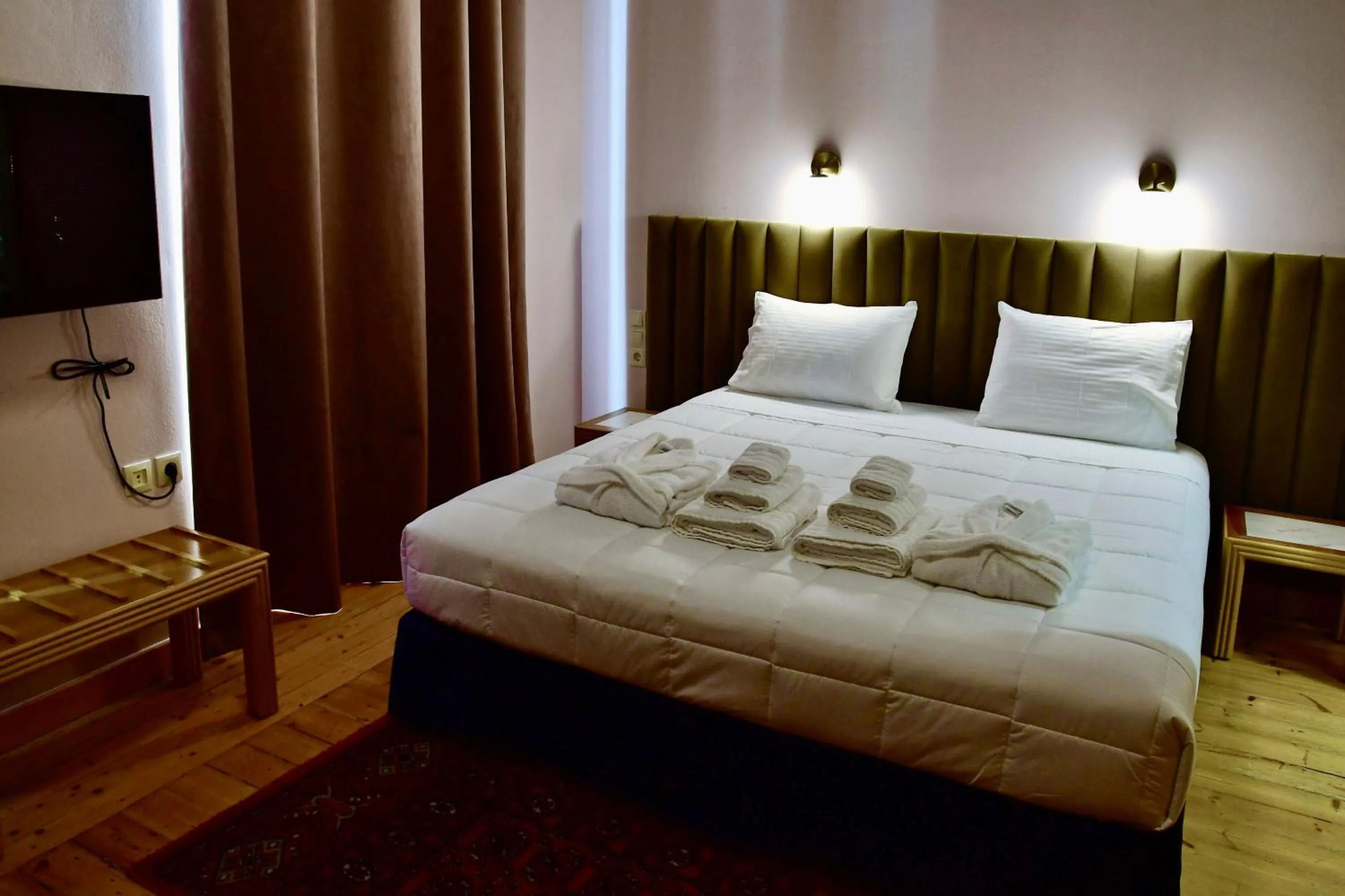 Photo of the whole room, Bed in VASILIKON Hotel 1888 the past is present HISTORICAL PRESERVATION MONUMENT