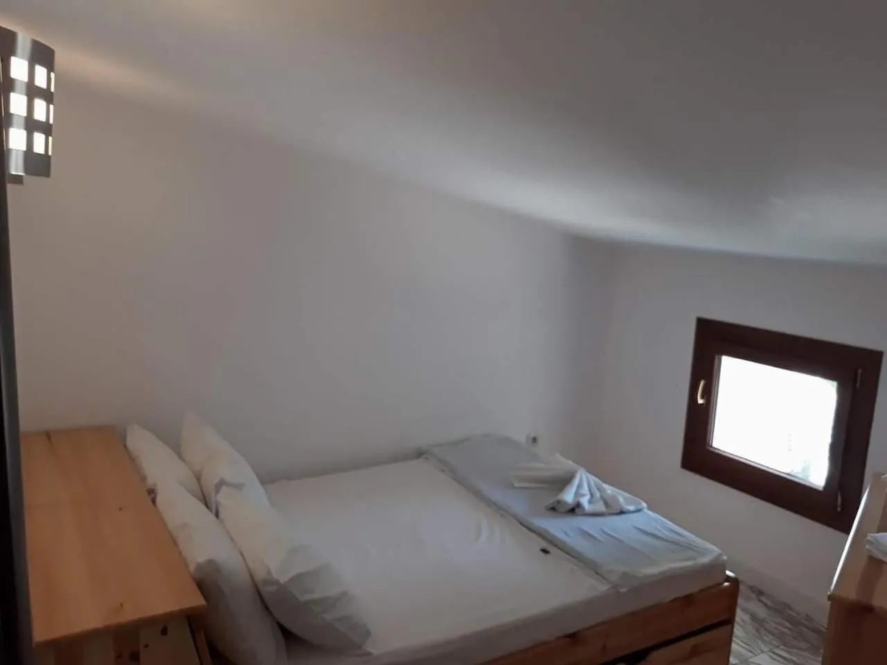 Bed in Kinira Beach Hotel