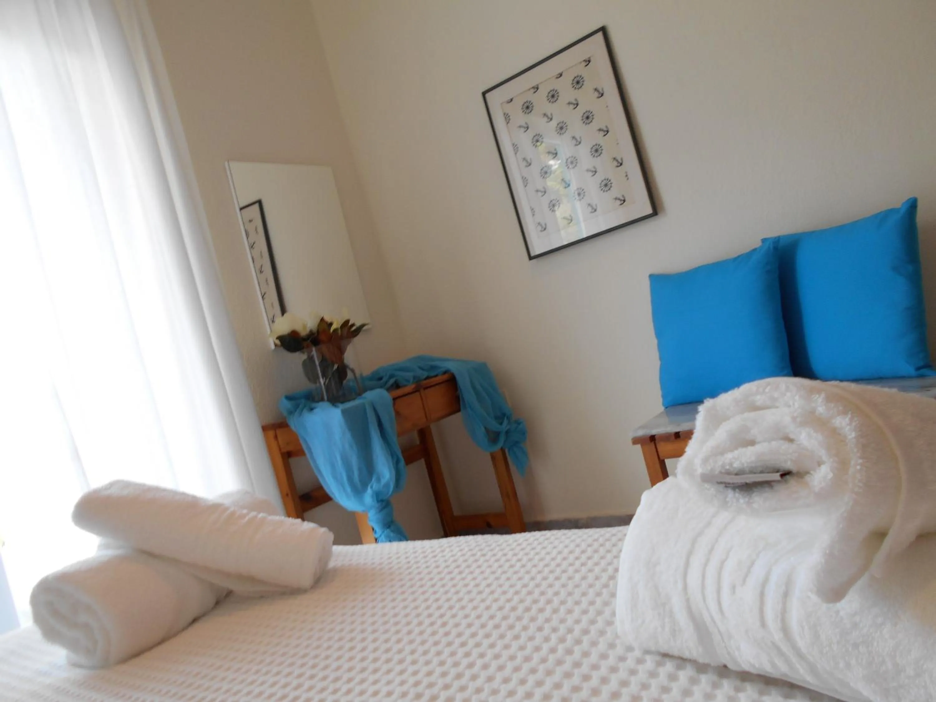 Bed in Kinira Beach Hotel