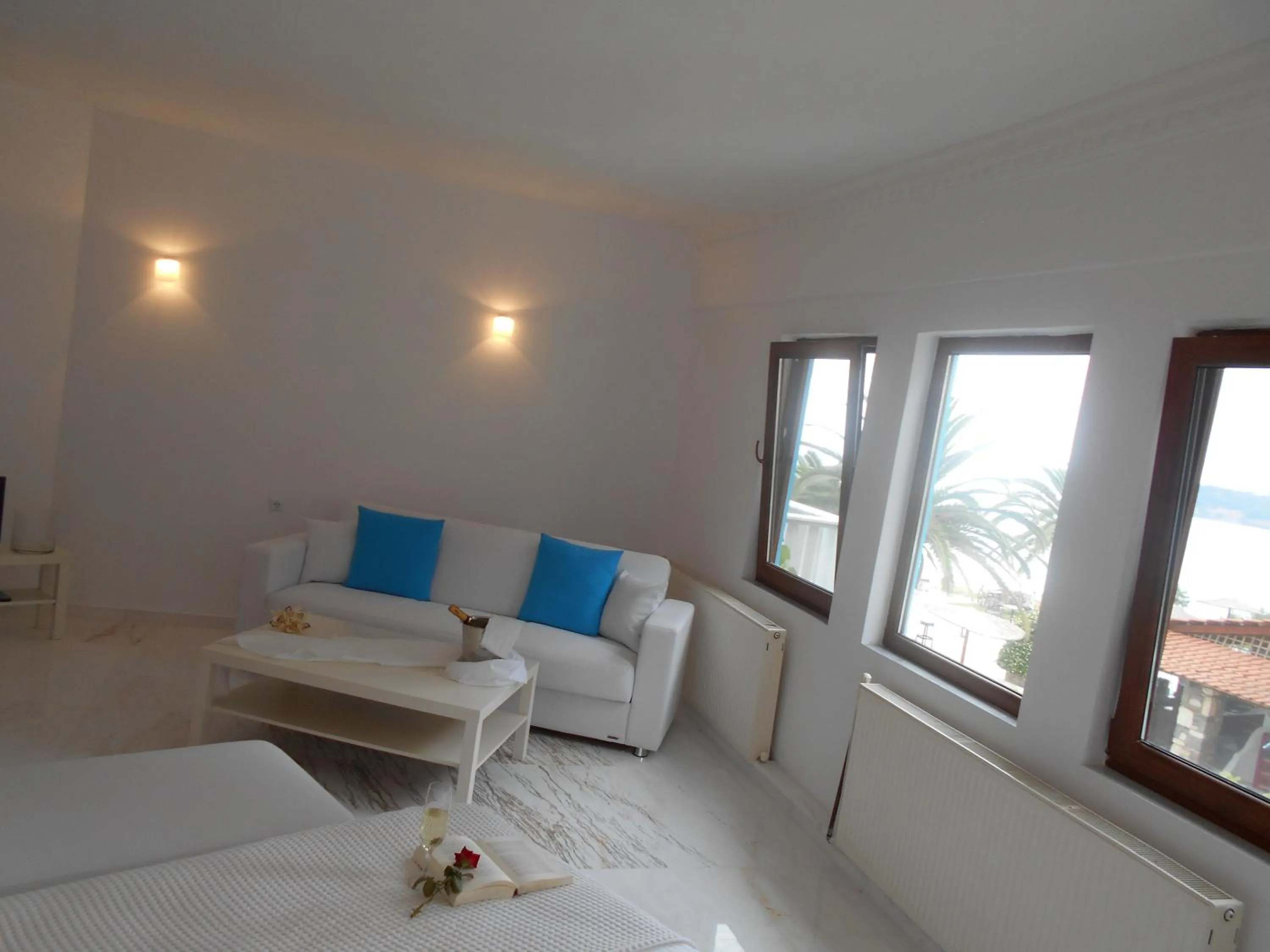 Seating area, Bed in Kinira Beach Hotel