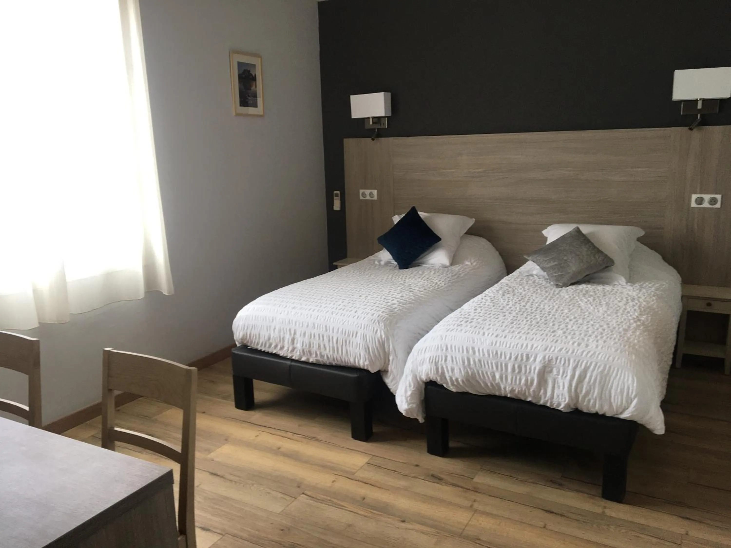 Bed in LOGIS HÔTEL RESTAURANT SPA Les BALCONS DE L'ESPERANCE