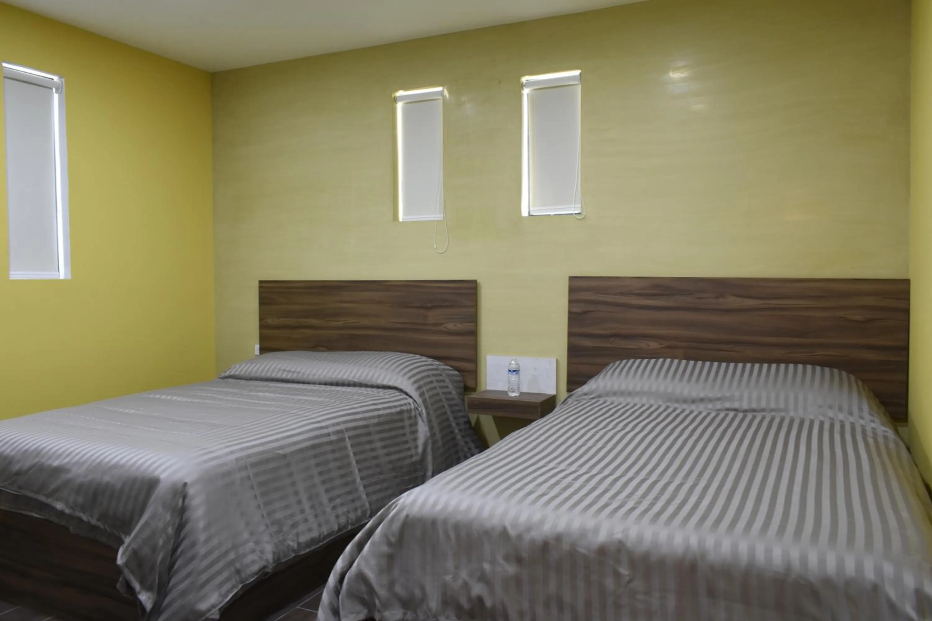 Bed in TJ Border Suites by Hosted by Me