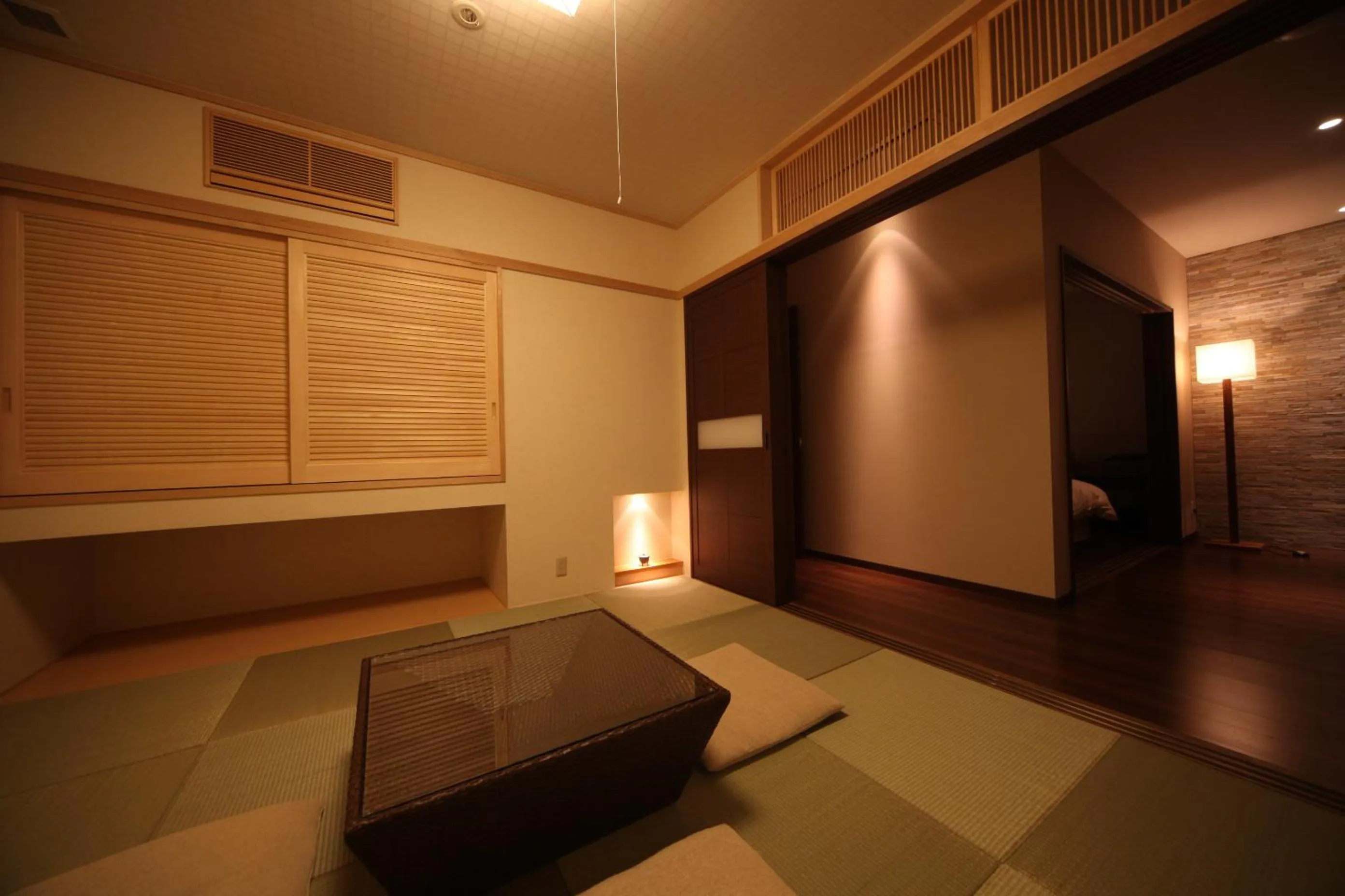 Seating area, Bed in AMANE resort SEIKAI