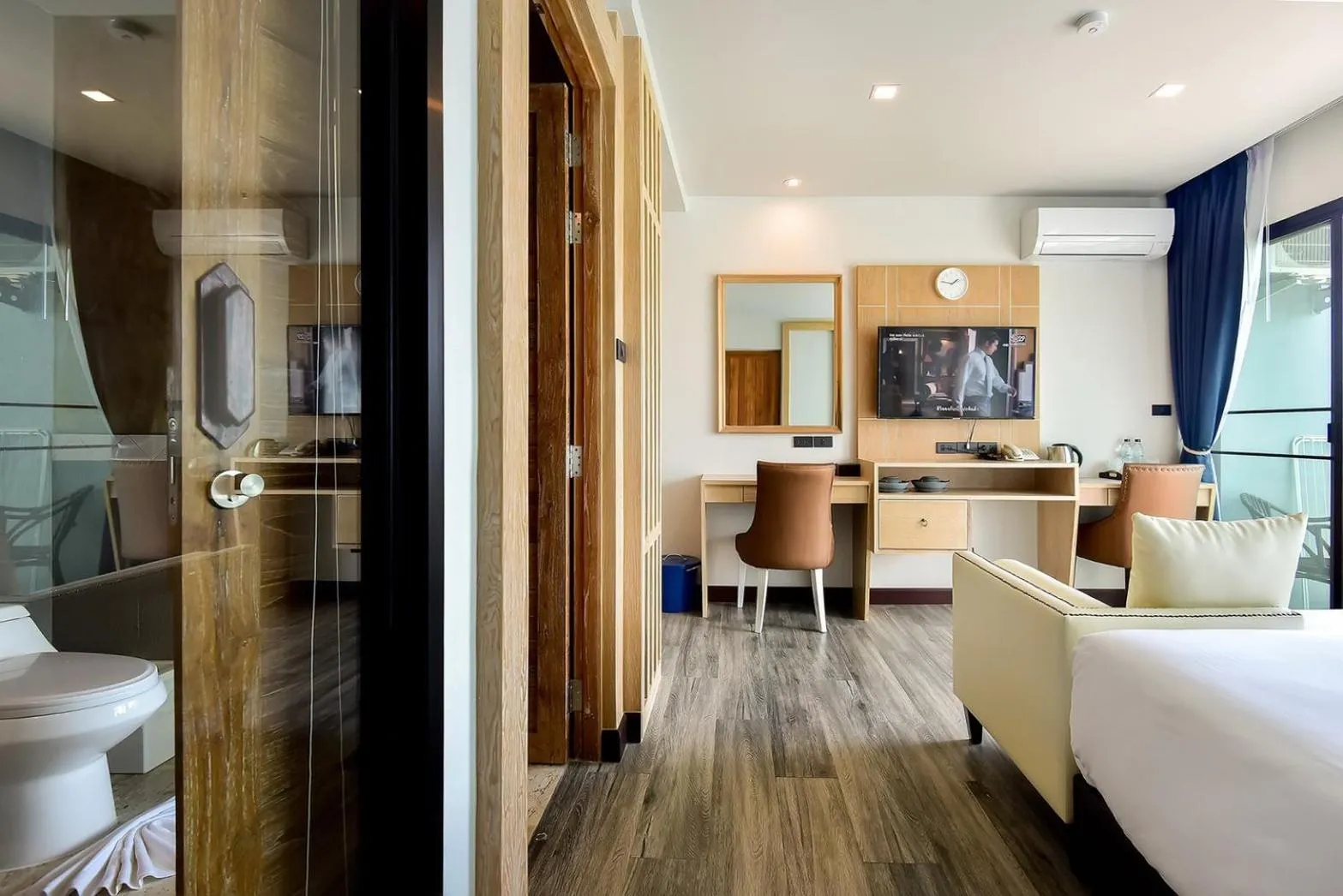 Seating area, Bed in Coco Paradiso Phuket SHA