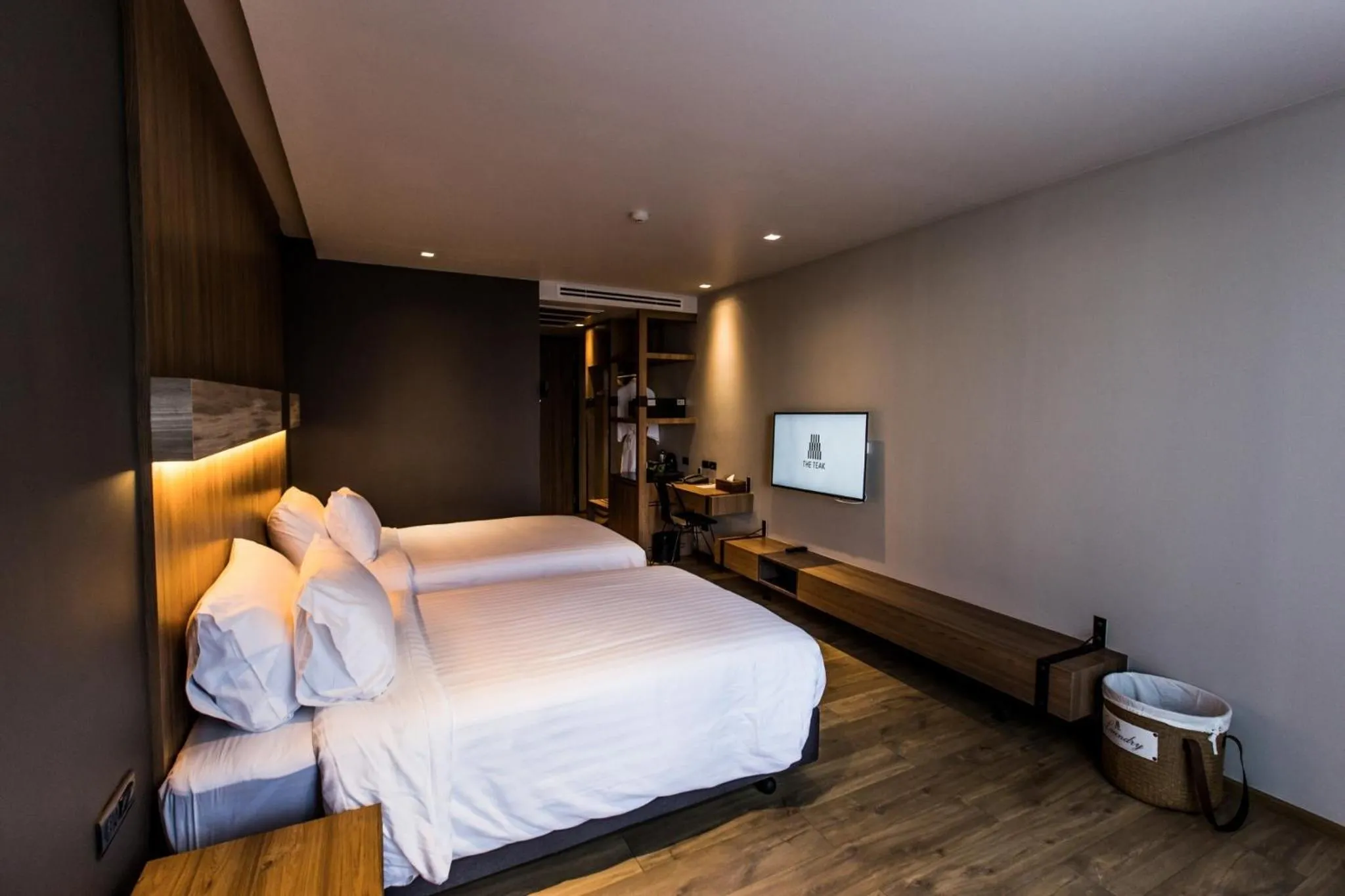 Bed in The Teak Hotel