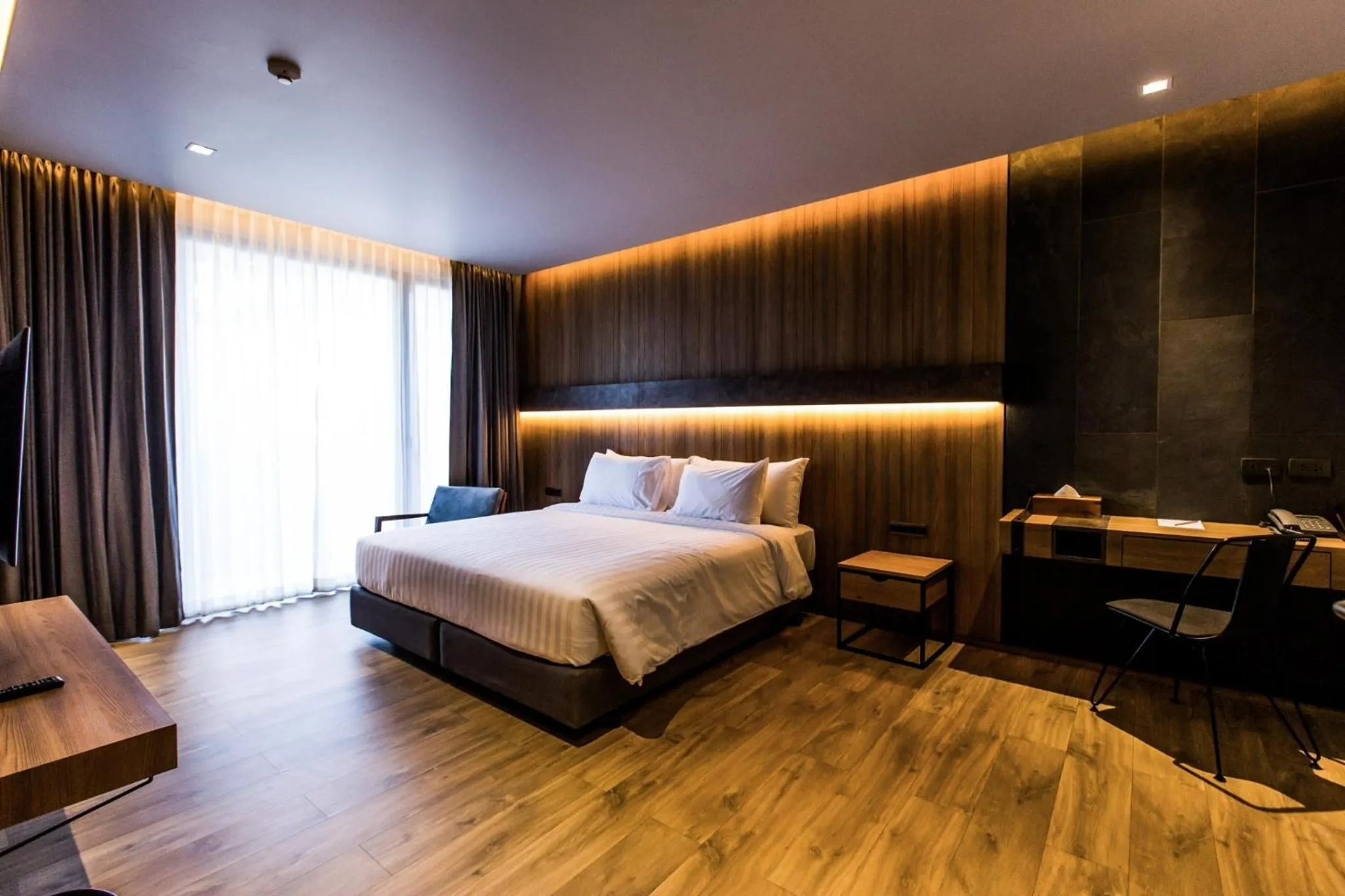 Bed in The Teak Hotel