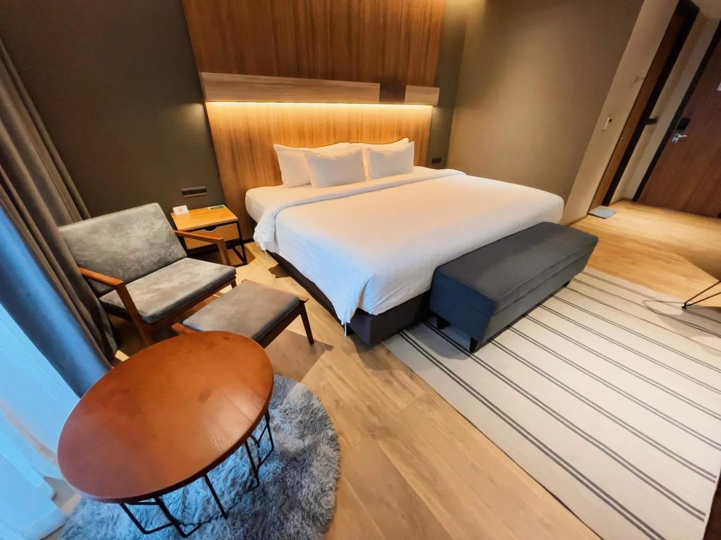 Bed in The Teak Hotel