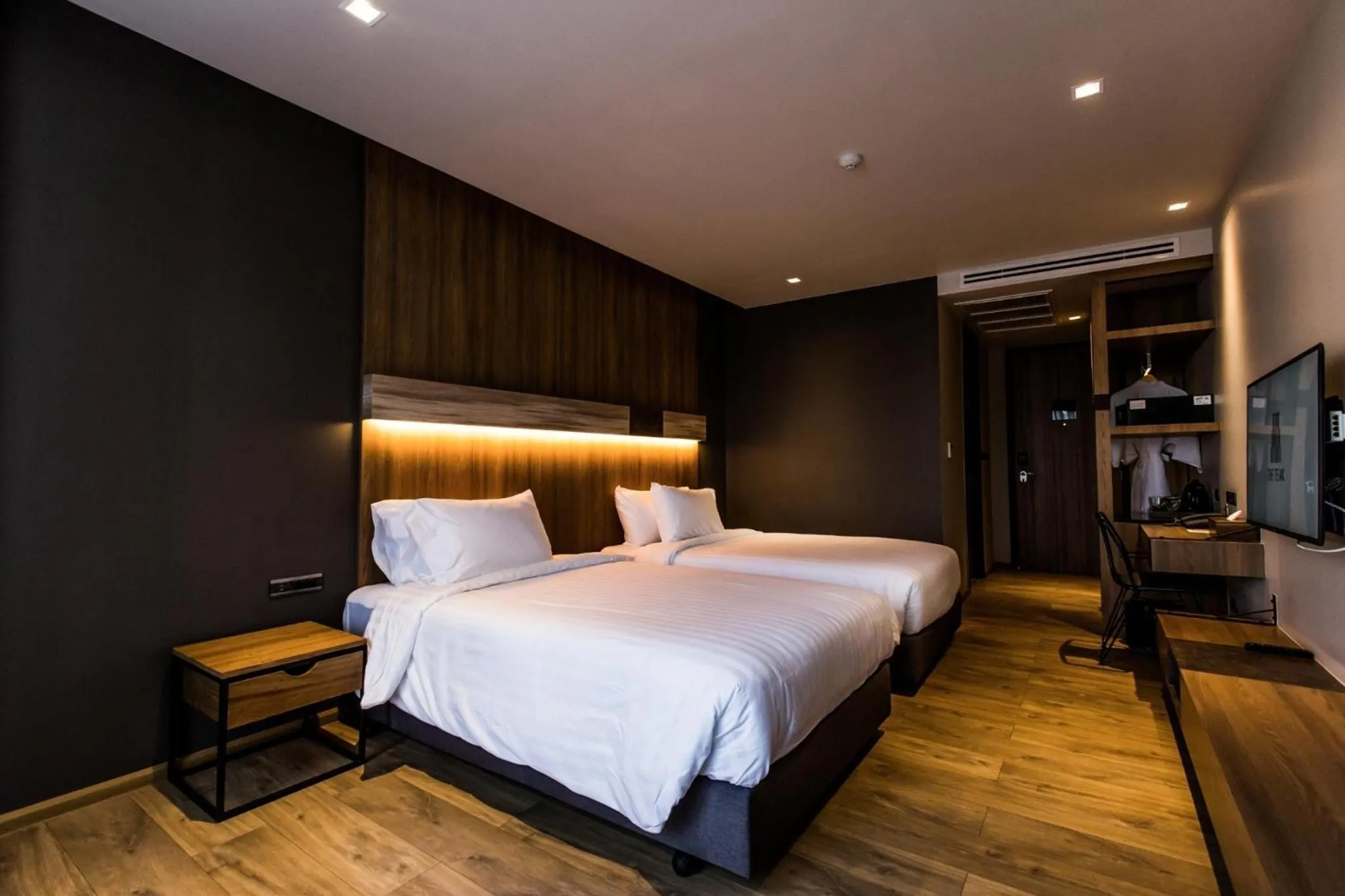 Bed in The Teak Hotel