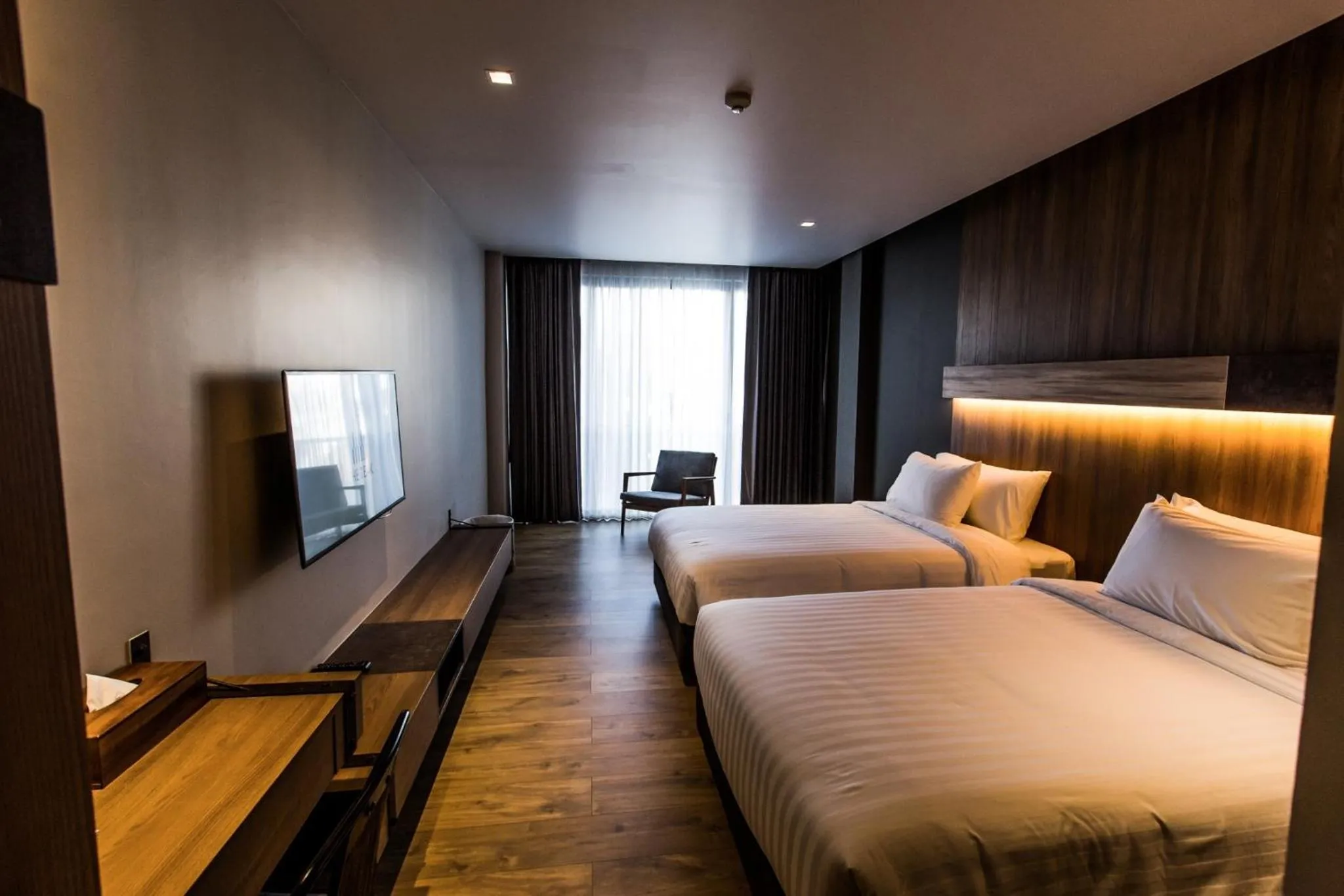 Bed in The Teak Hotel