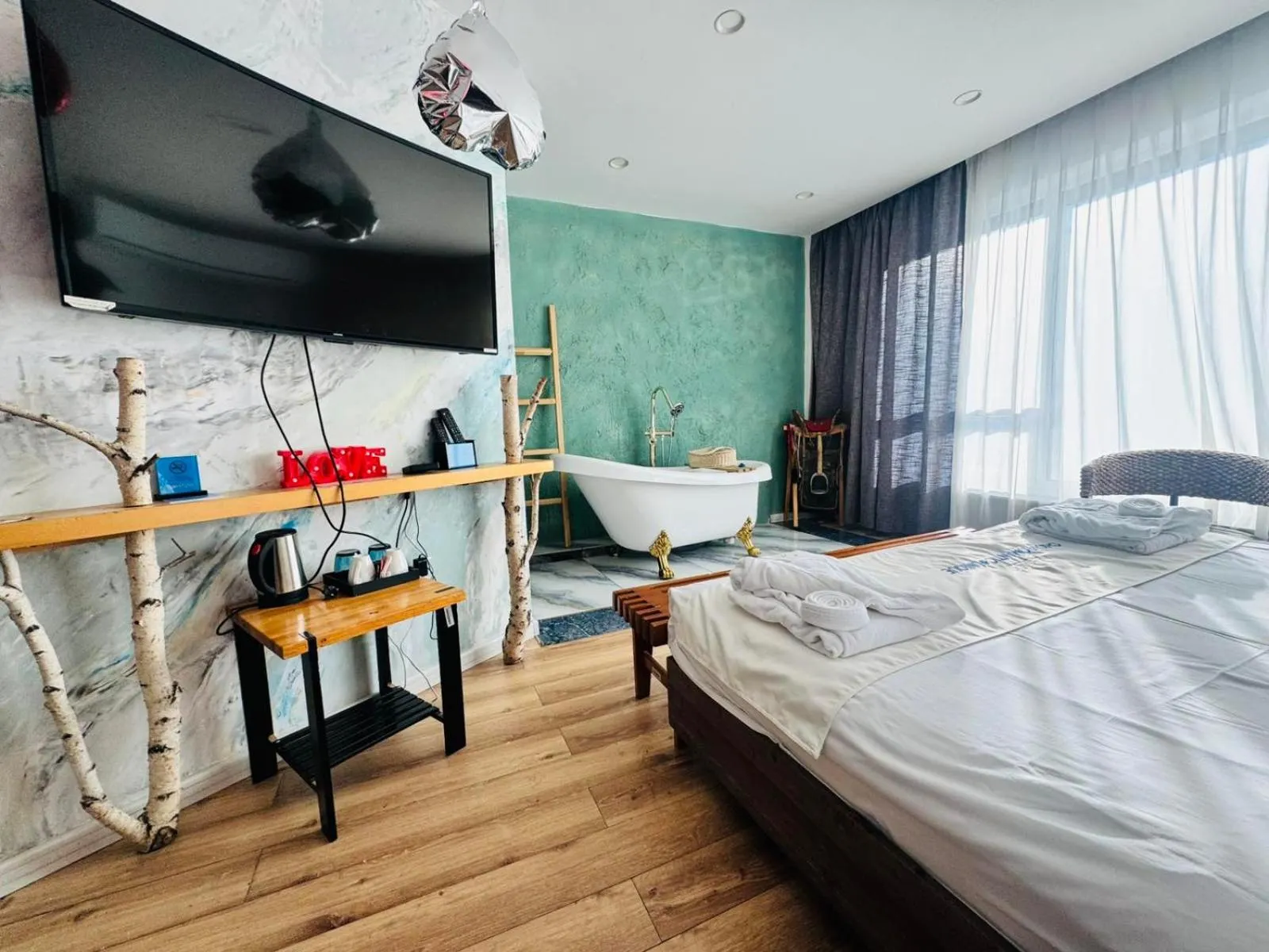 Communal lounge/ TV room, Bed in Nomado Boutique Hotel