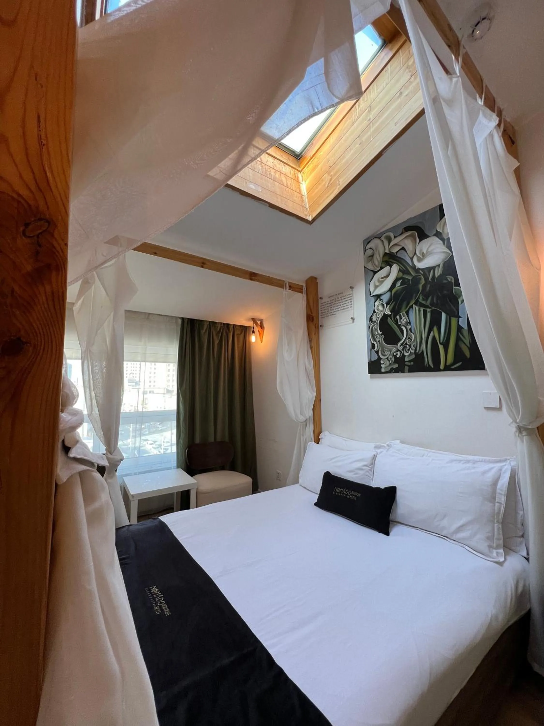 Bed in Nomado Boutique Hotel