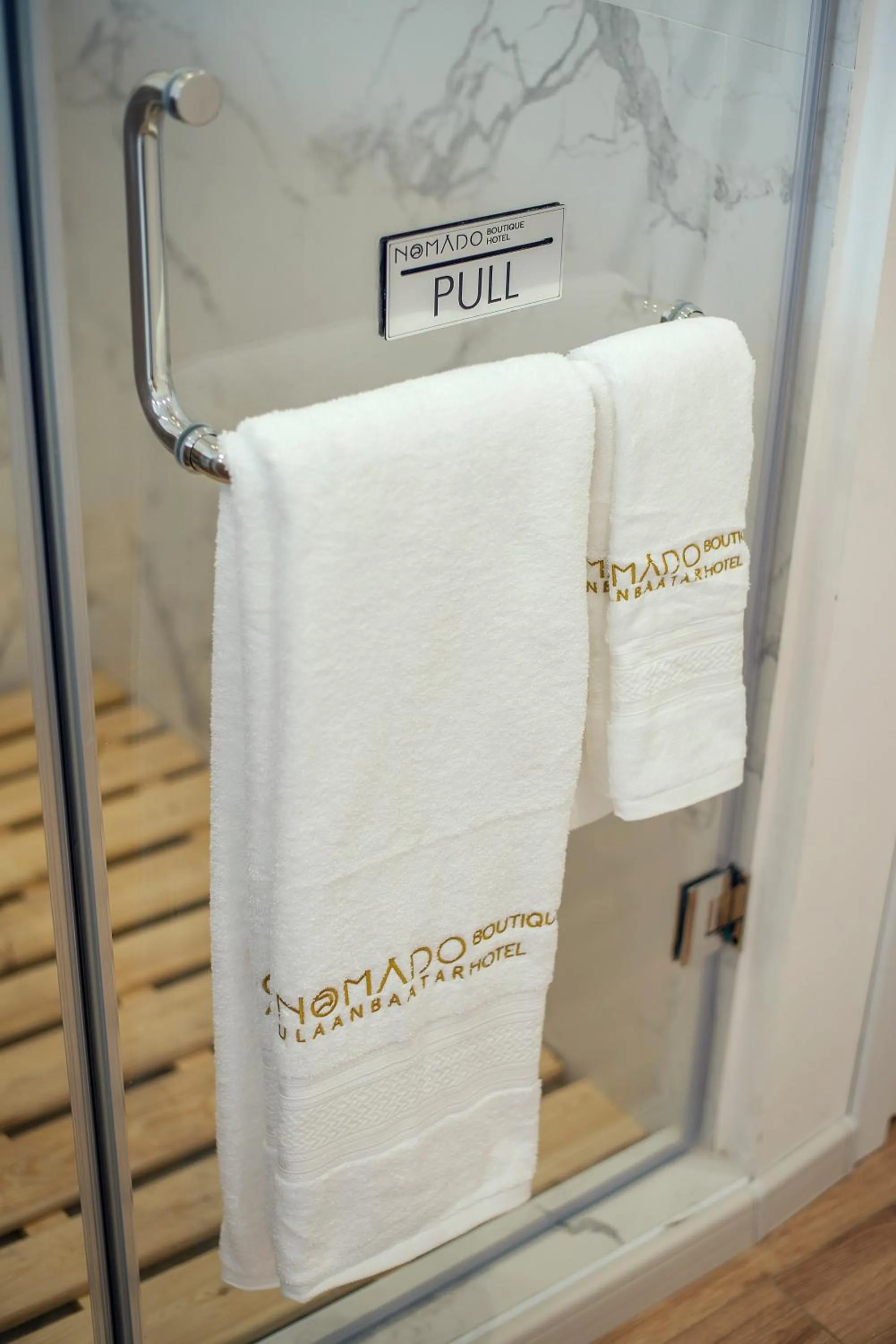 Property logo or sign in Nomado Boutique Hotel