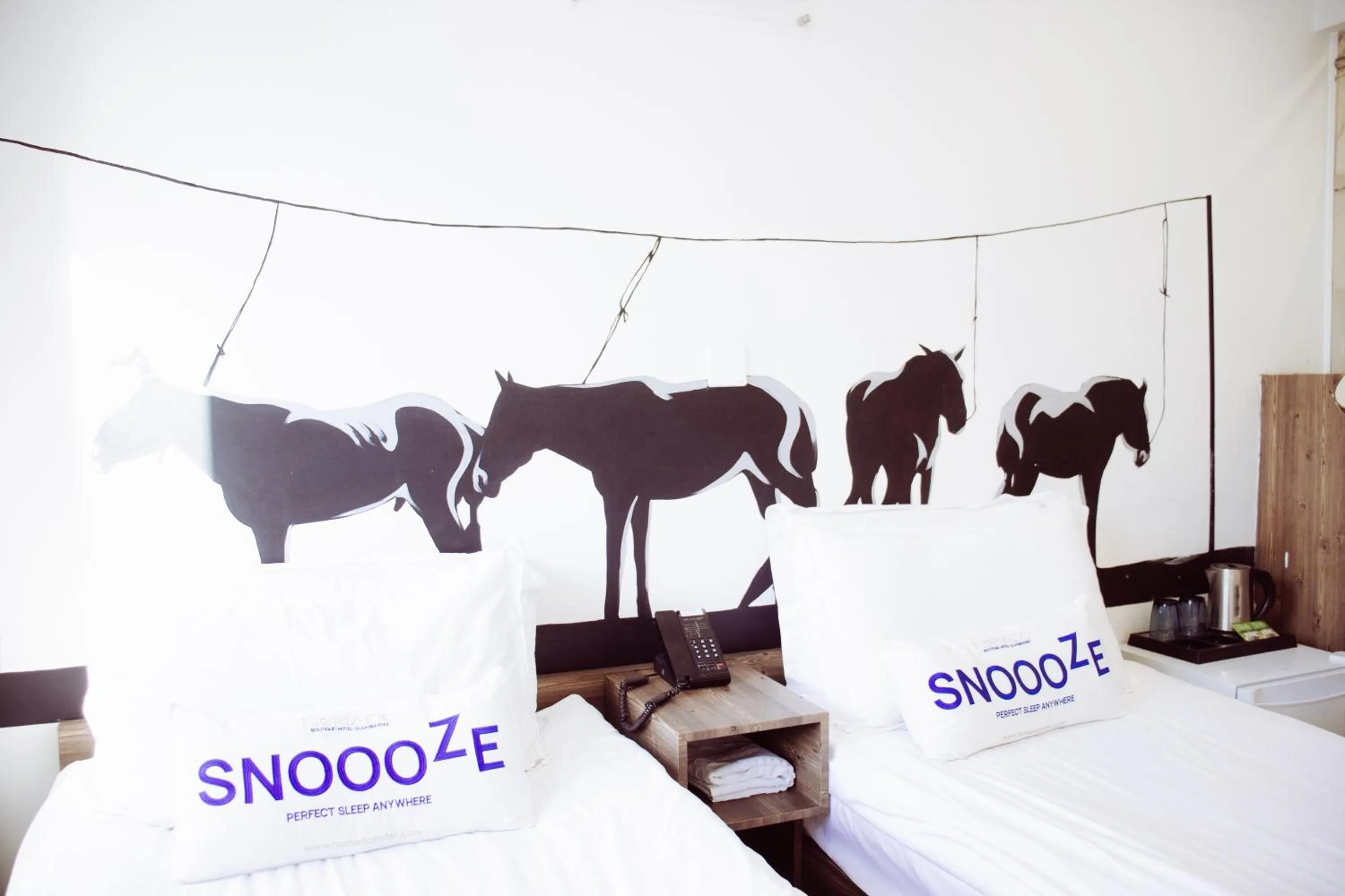 Bed in Nomado Boutique Hotel
