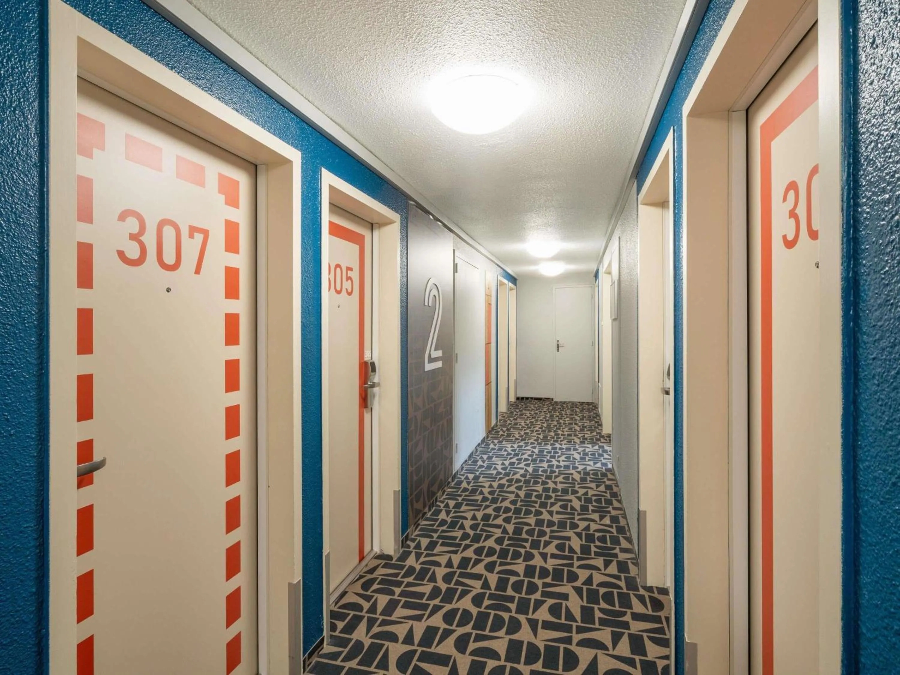 Bedroom in ibis budget Nantes Sainte Luce - Hôtel Rénové