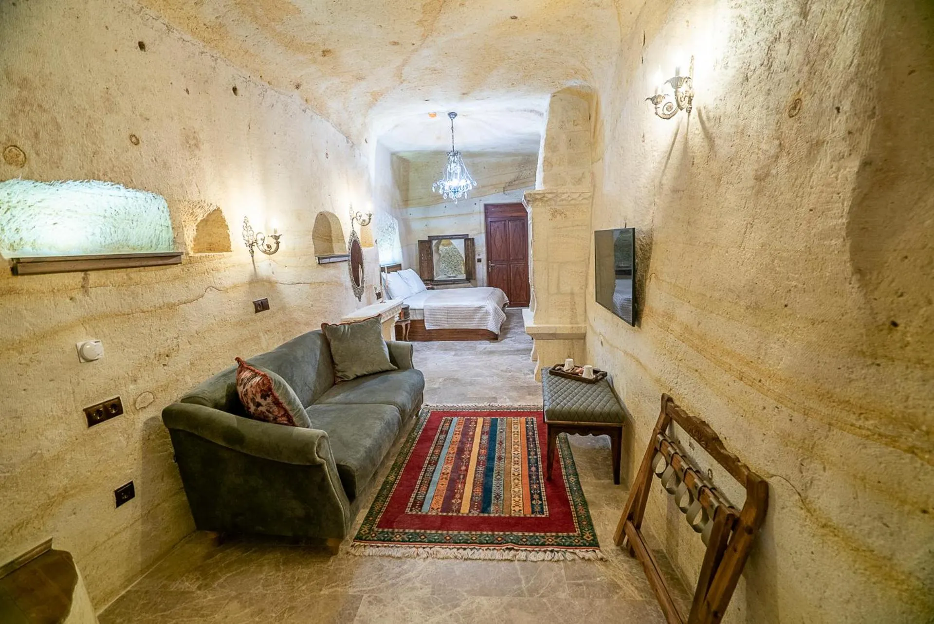 Seating area, Bed in Zeydem Suites