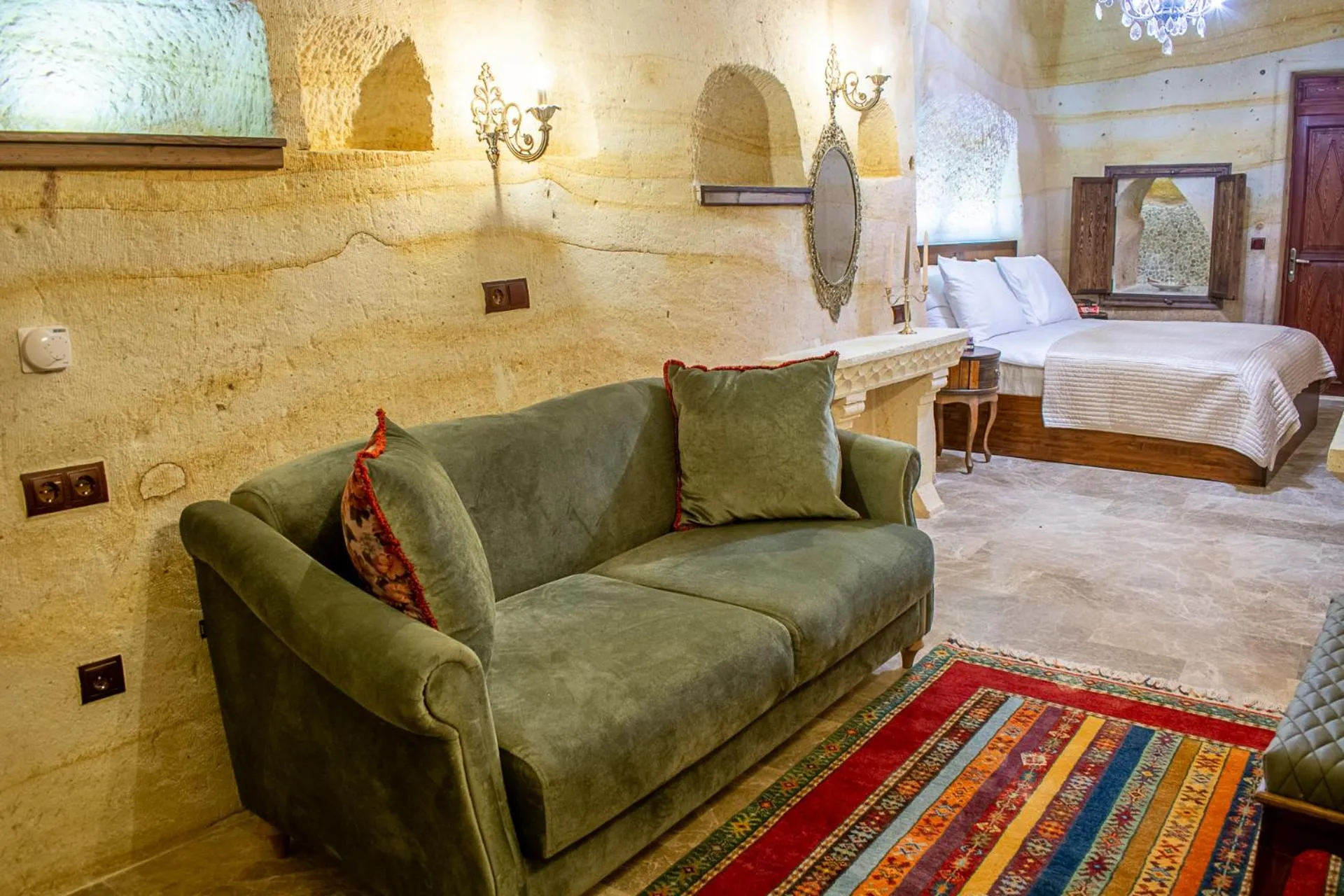 Seating area, Bed in Zeydem Suites