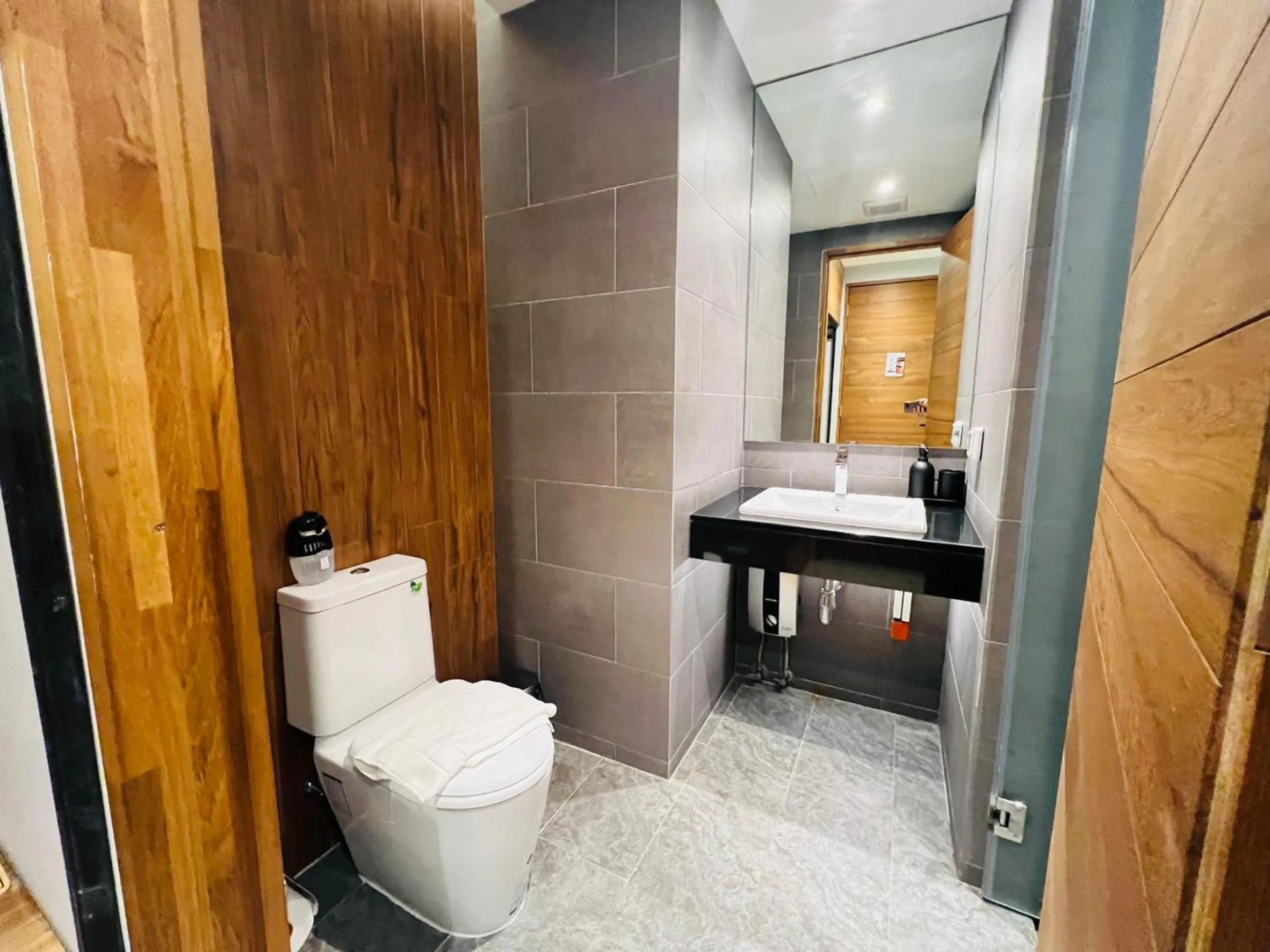 Toilet in Woodstory Boutique Hotel