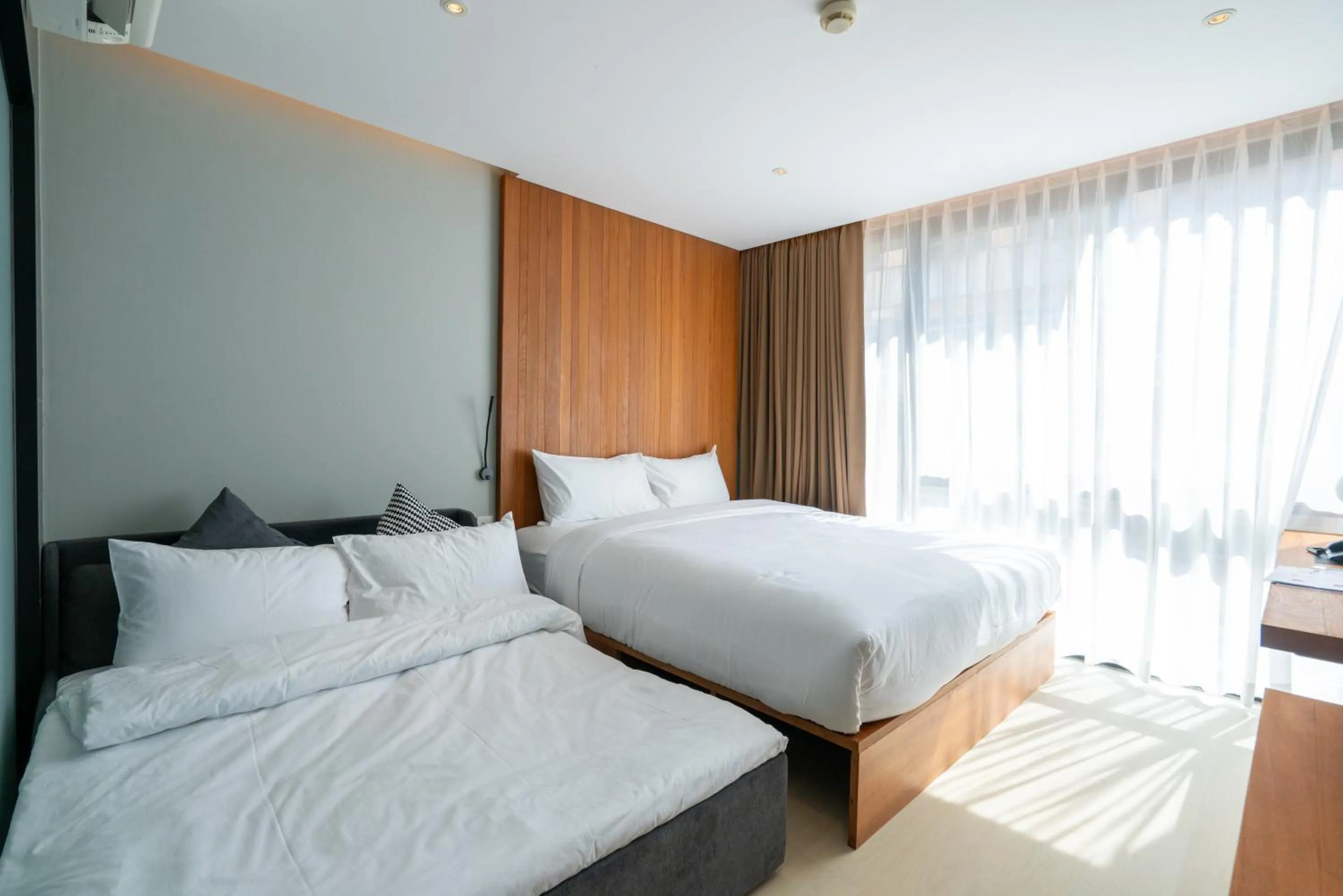 Bed in Woodstory Boutique Hotel