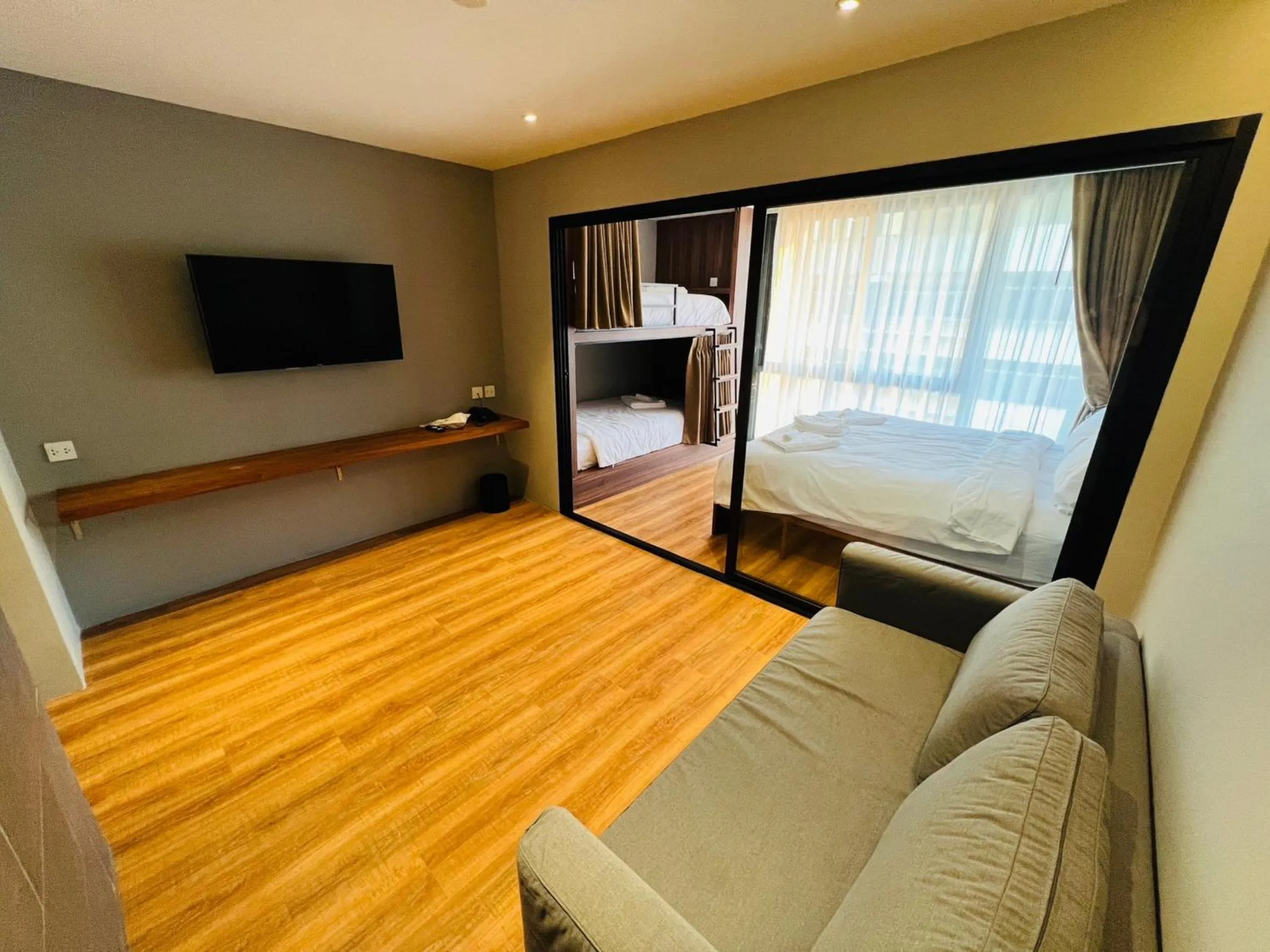 Communal lounge/ TV room, Bed in Woodstory Boutique Hotel