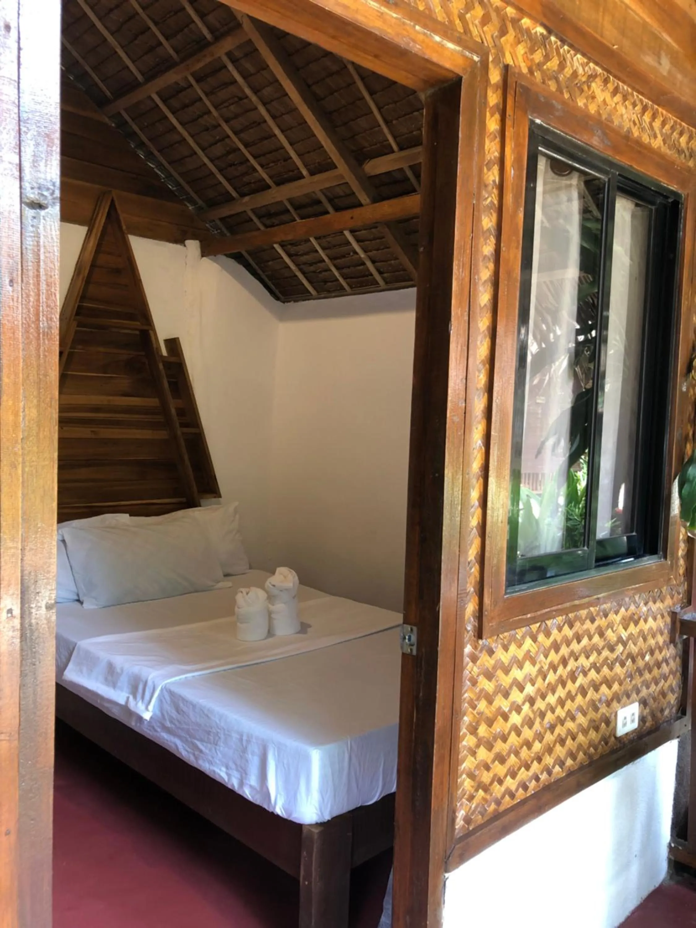 Bed in Zhaya's Beach & Cottages