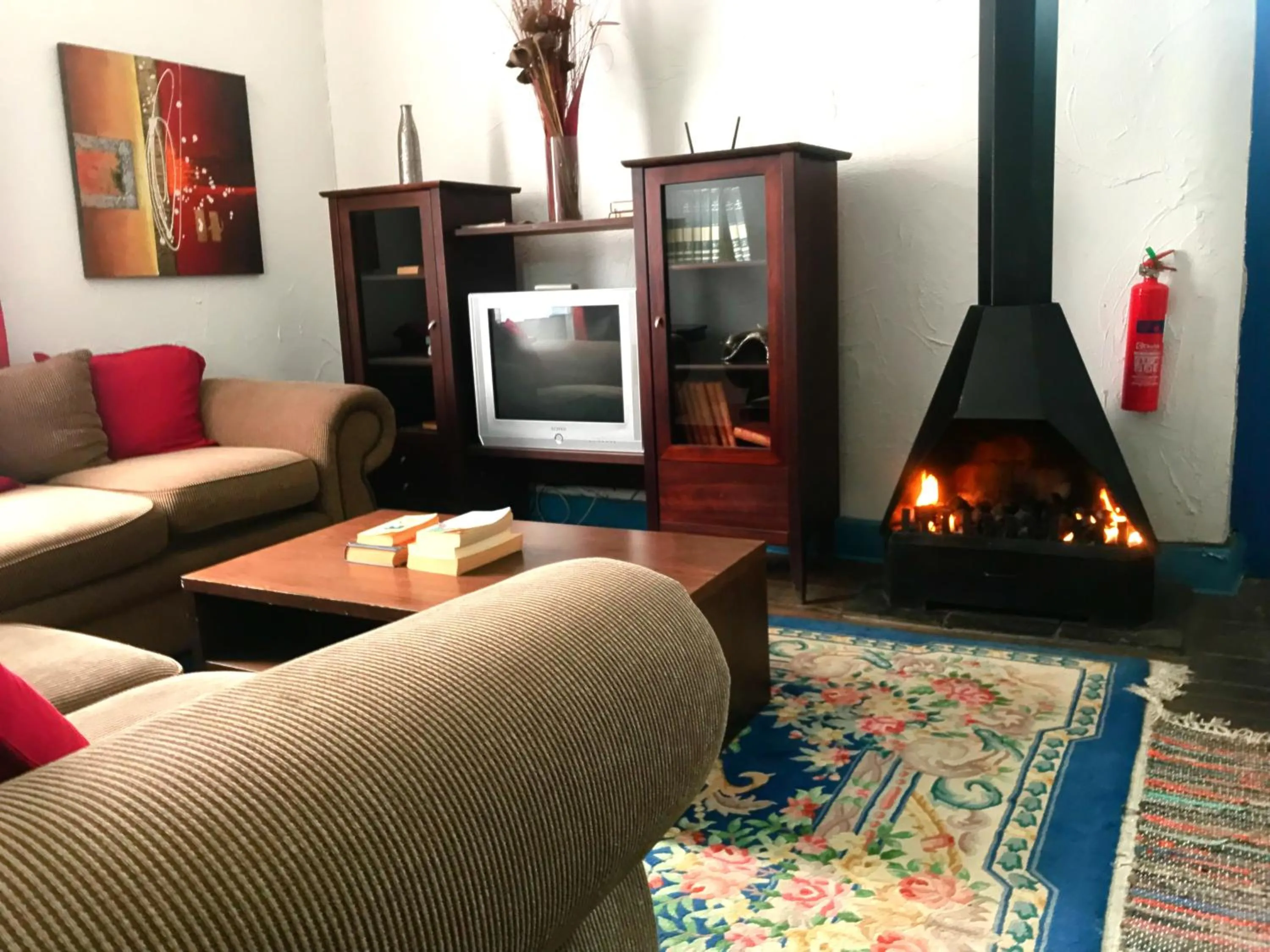 Communal lounge/ TV room in Athenian Villa