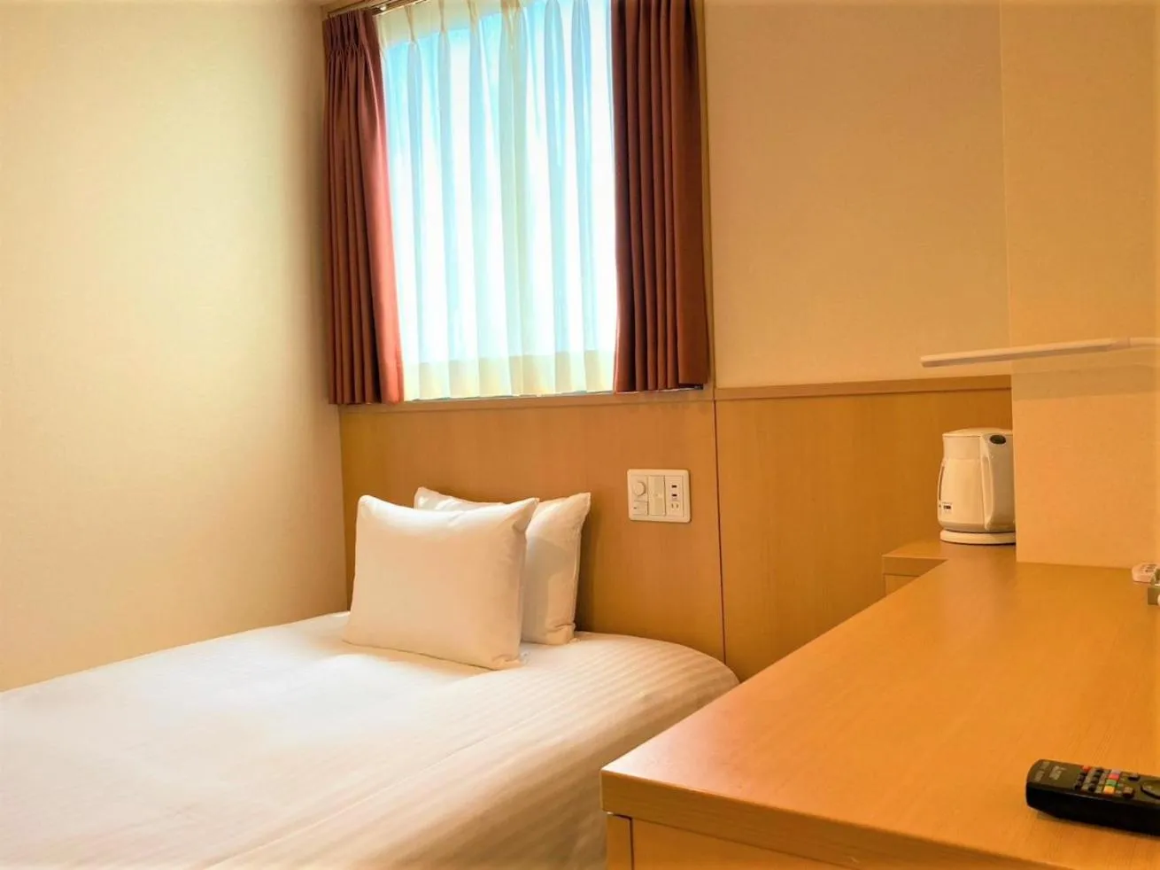 Bed in SAKURA SKY HOTEL KASHIWA(桜スカイホテル柏)