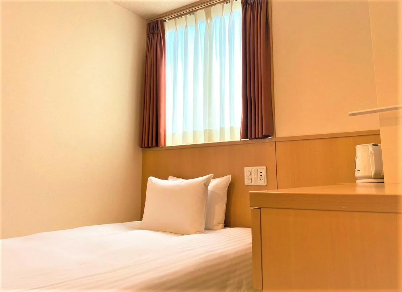 Bed in SAKURA SKY HOTEL KASHIWA(桜スカイホテル柏)