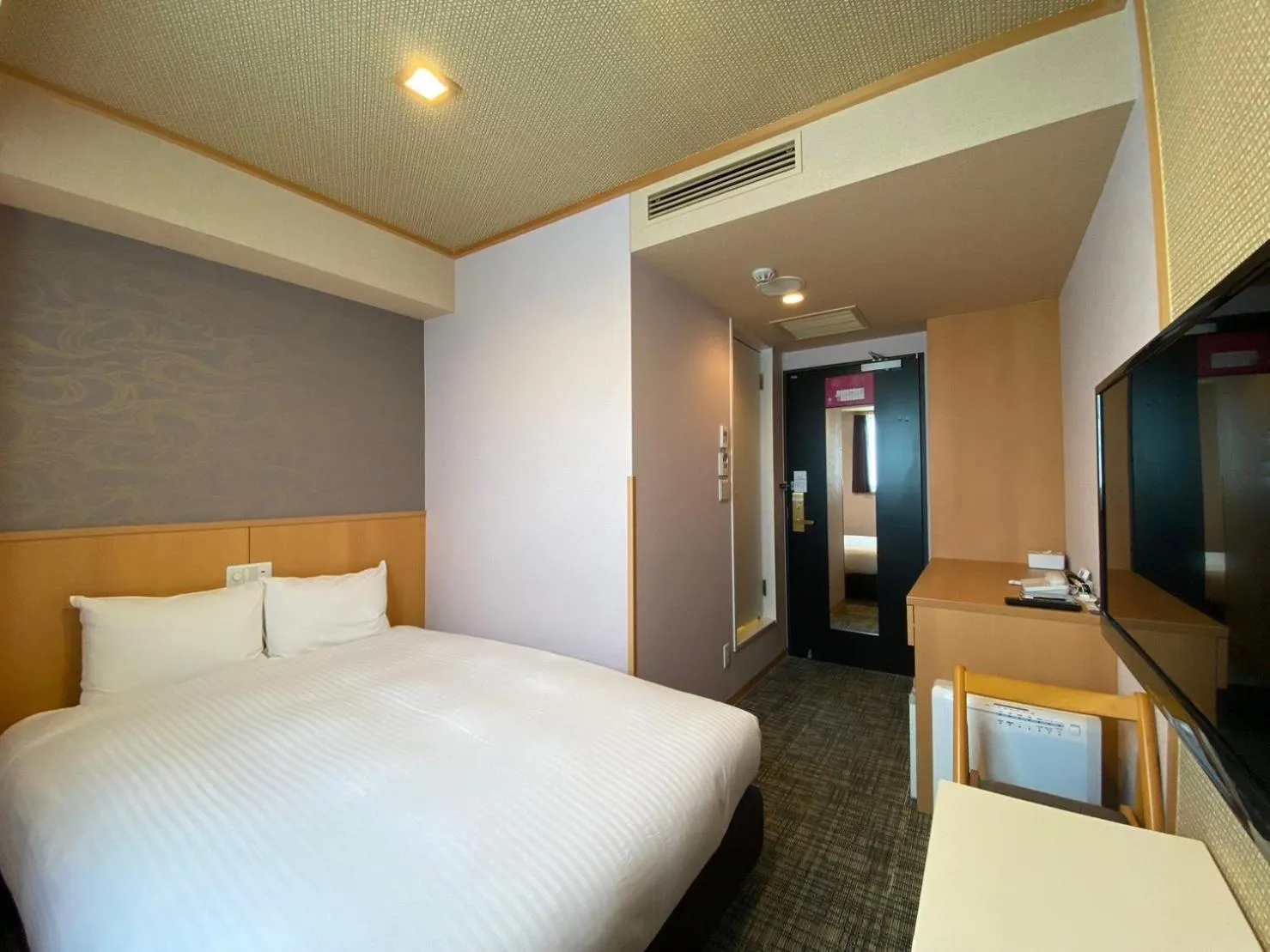 Bed in SAKURA SKY HOTEL KASHIWA(桜スカイホテル柏)