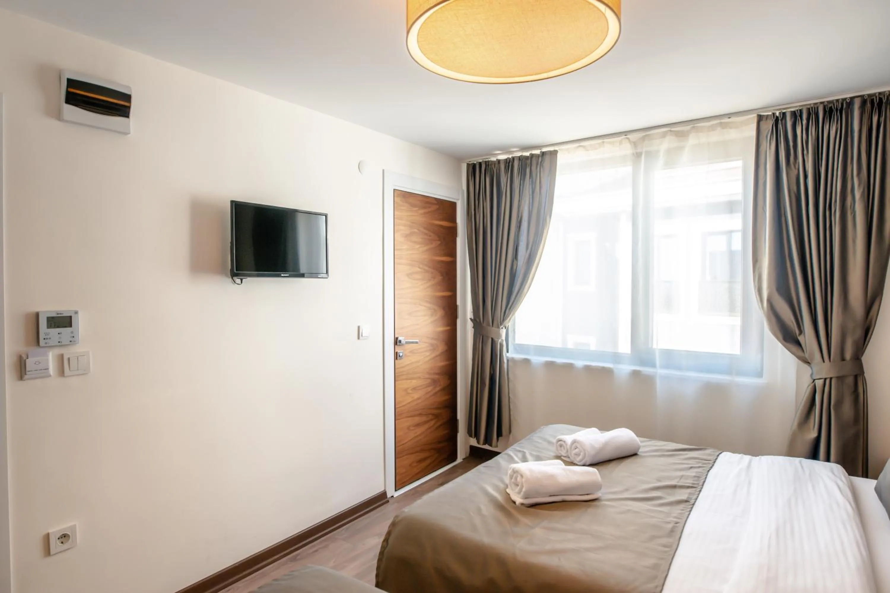 Bed in The Camelot Hotel