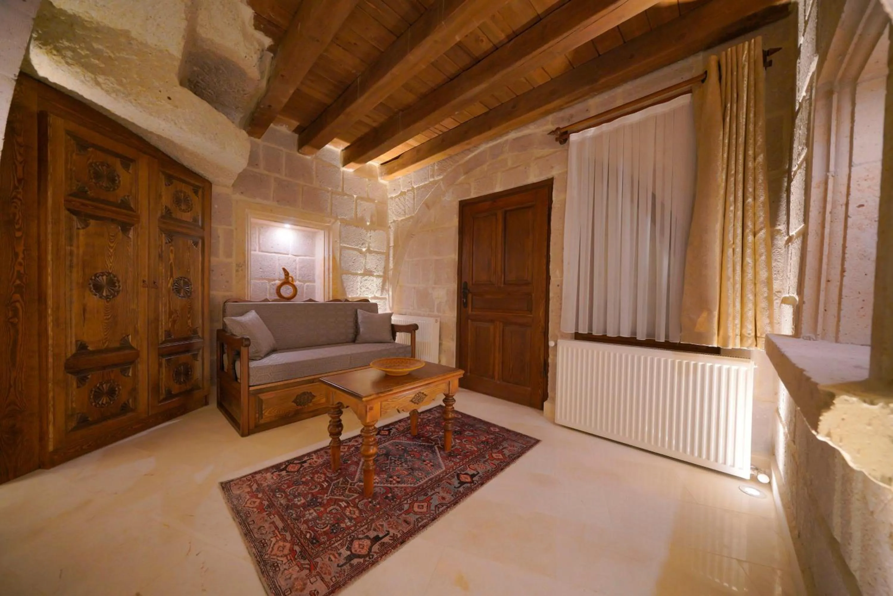 Seating area, Bed in Fairyland Cave Hotel