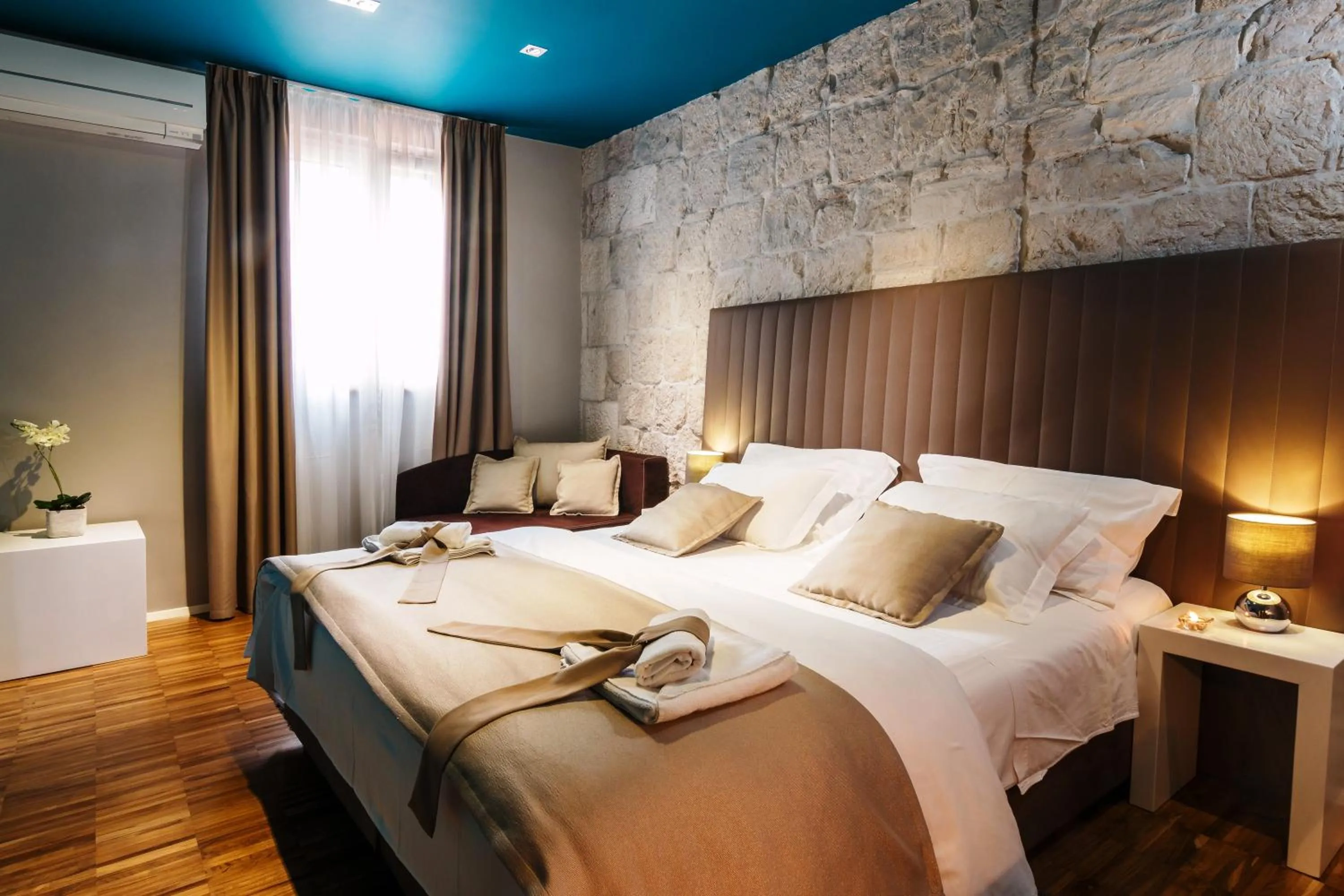 Bed in Riva Luxury Rooms