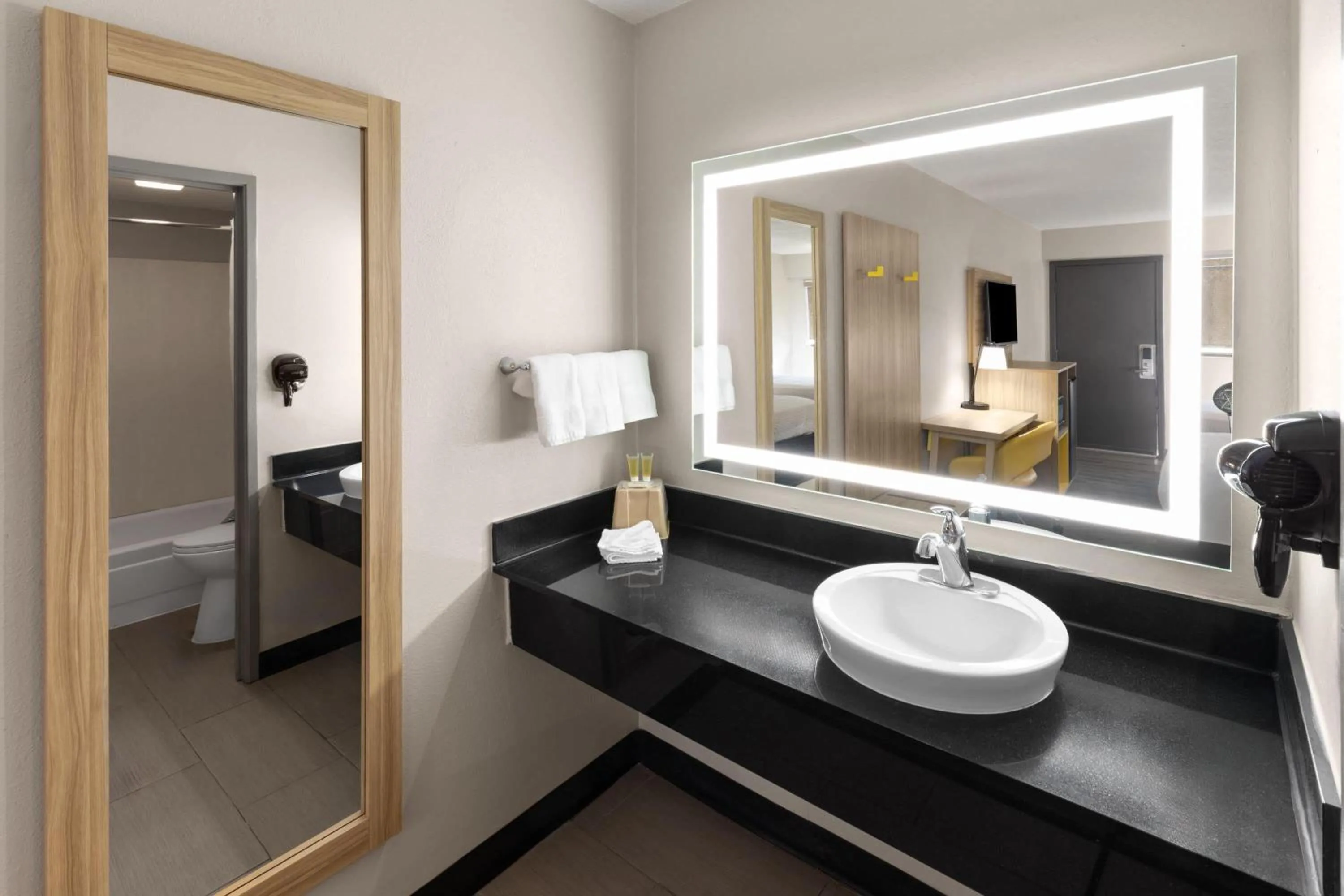 Bathroom in Days Inn by Wyndham Kansas City Northeast