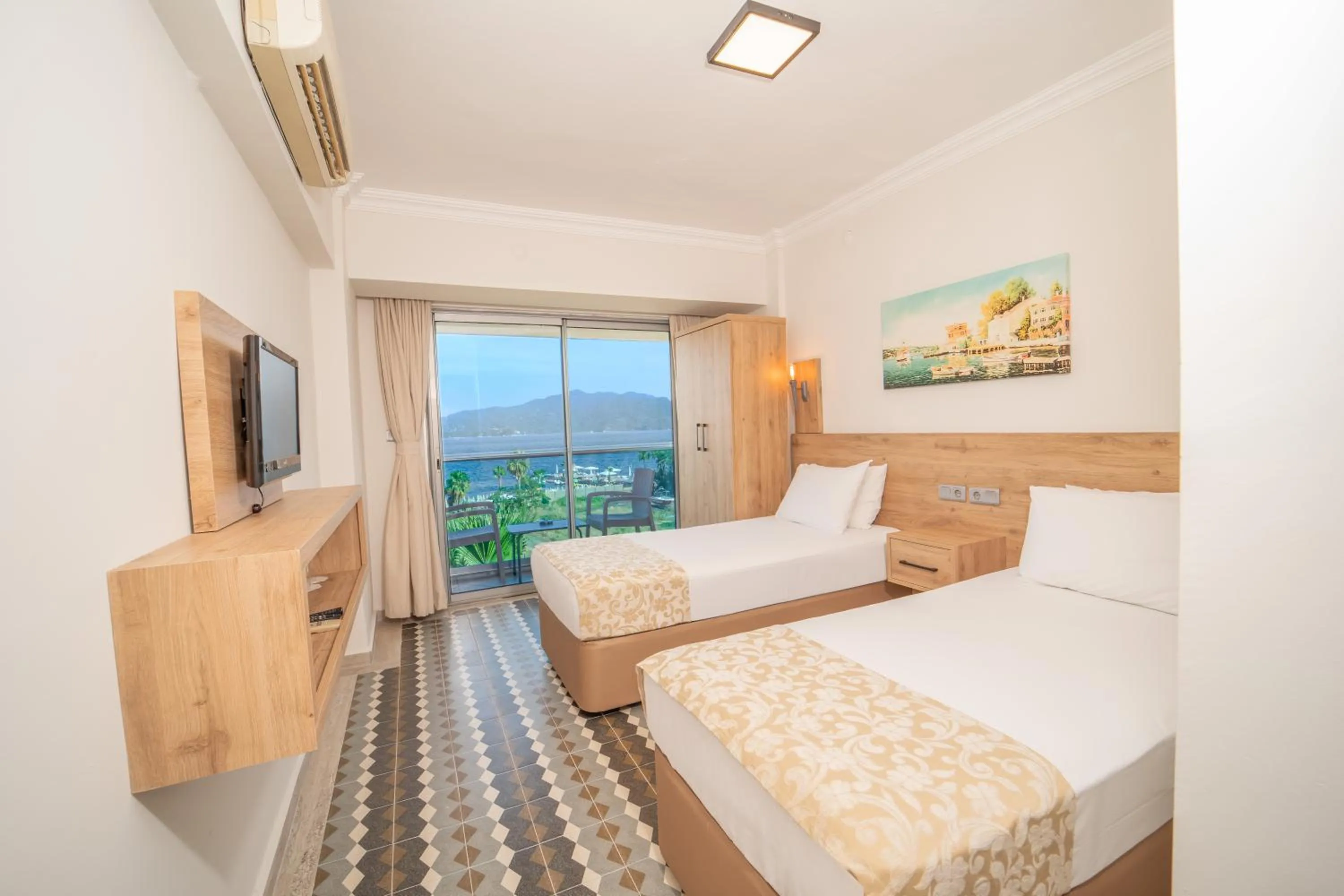 Bed in Moda Beach Hotel