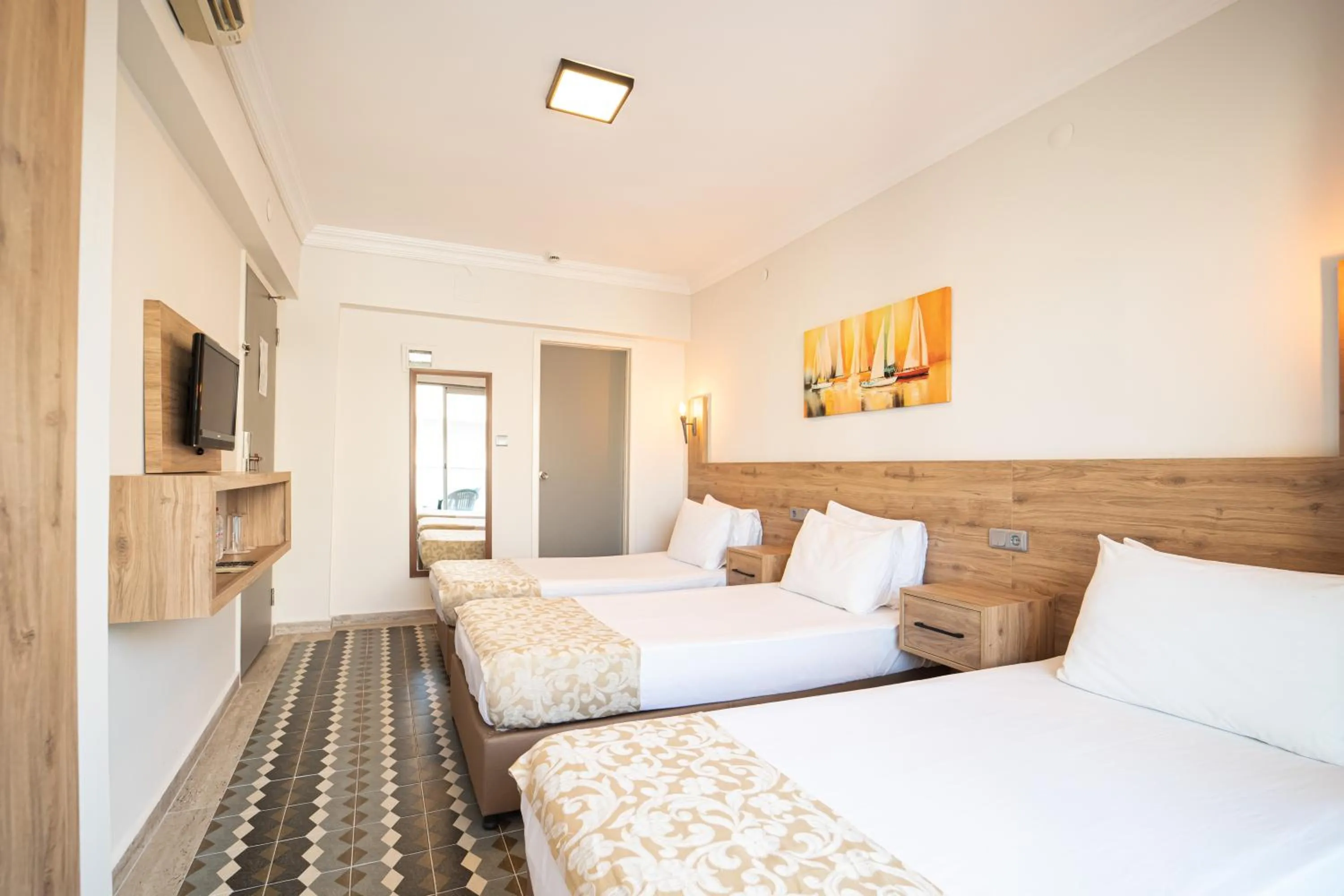 Bed in Moda Beach Hotel