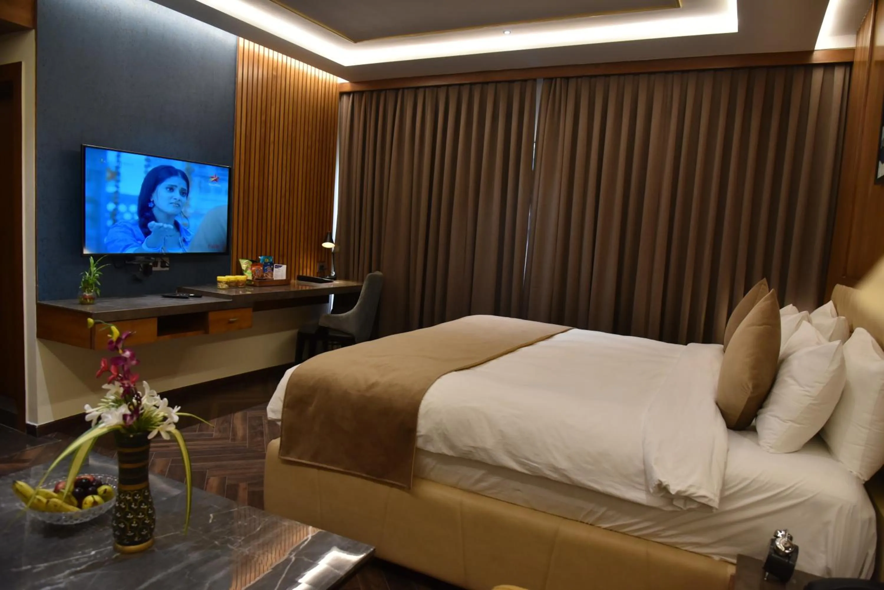 Bed in Ramada Encore by Wyndham Statue of Unity