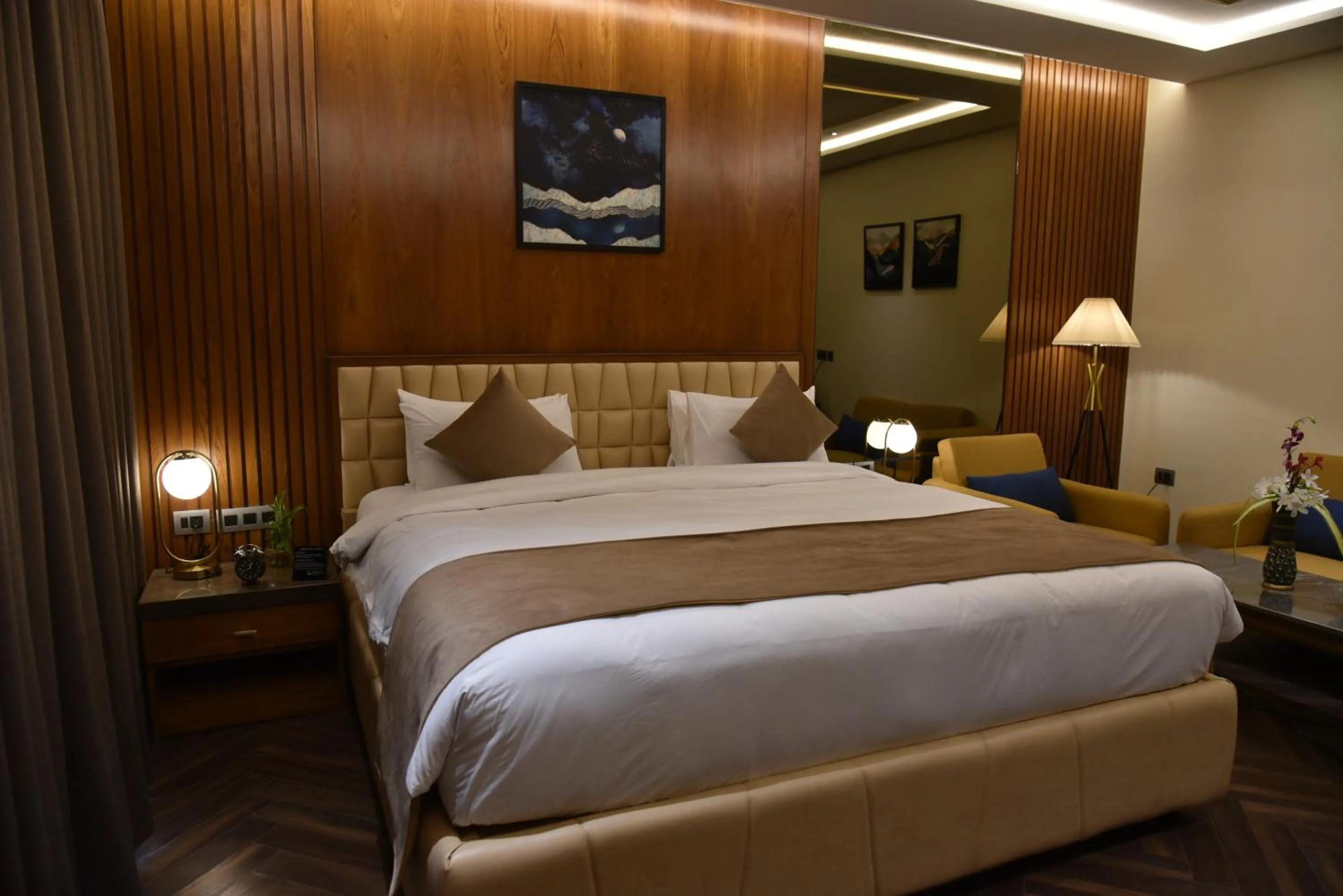 Bed in Ramada Encore by Wyndham Statue of Unity