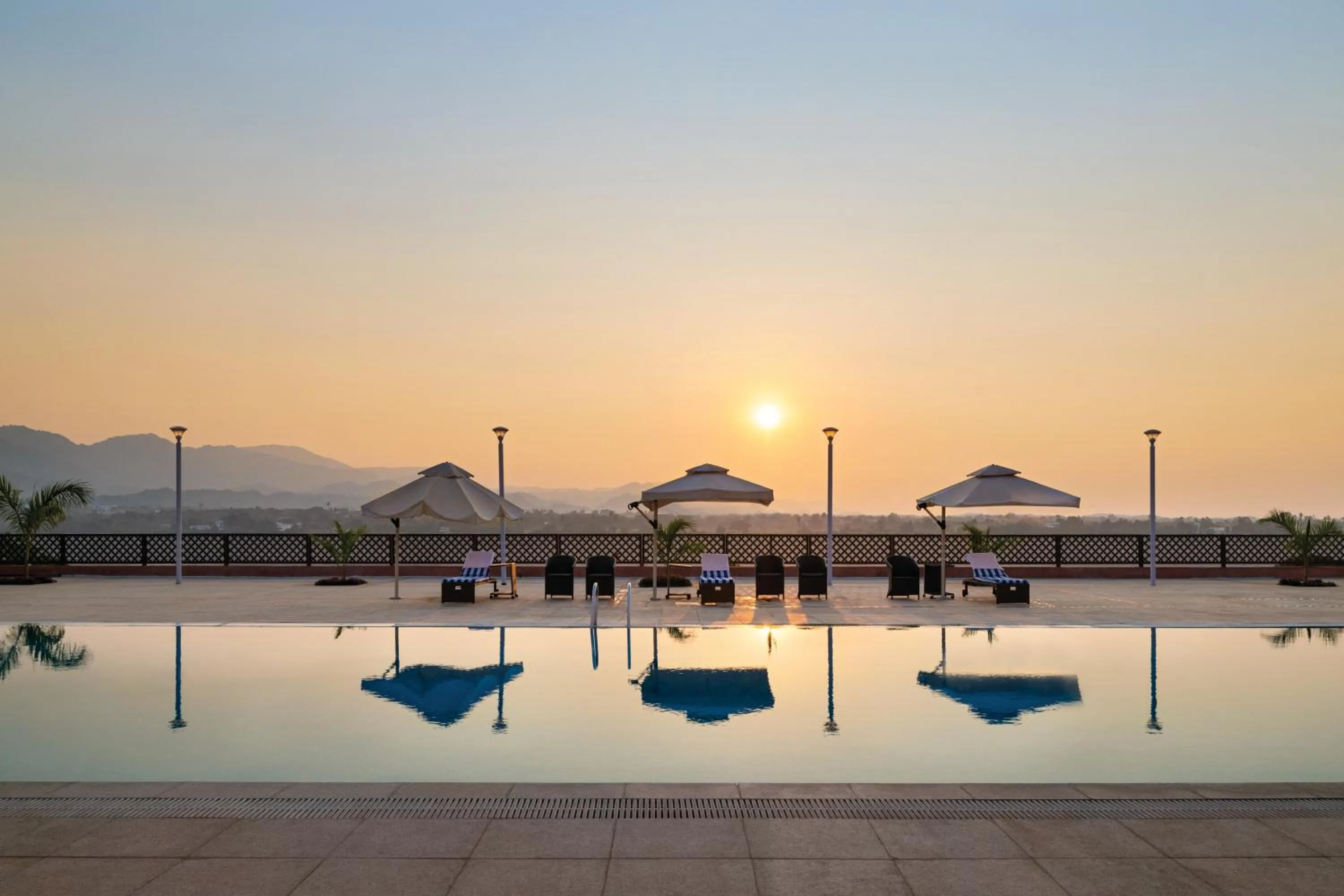 Swimming pool in Ramada Encore by Wyndham Statue of Unity