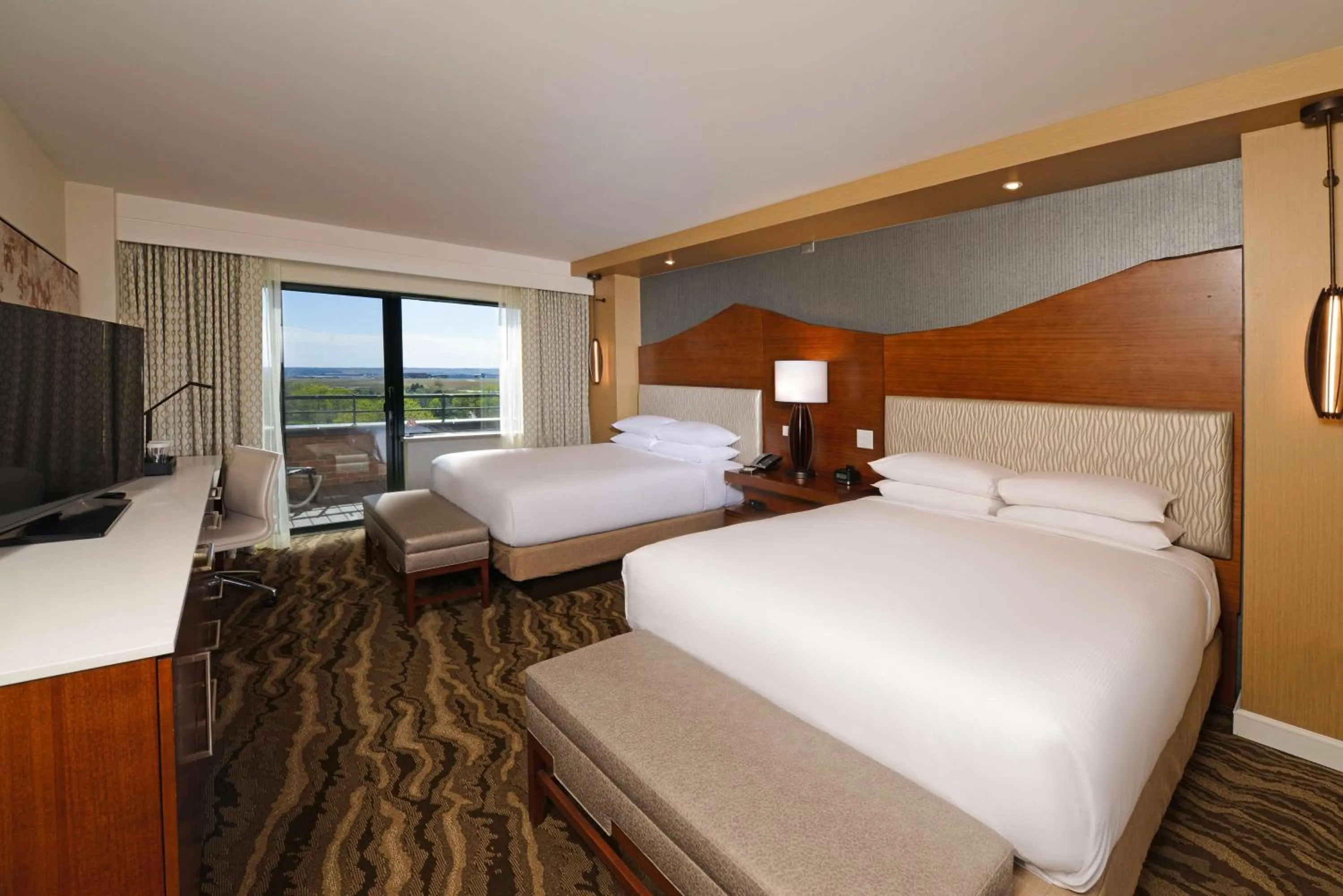 Bed in The Inverness Denver, a Hilton Golf & Spa Resort