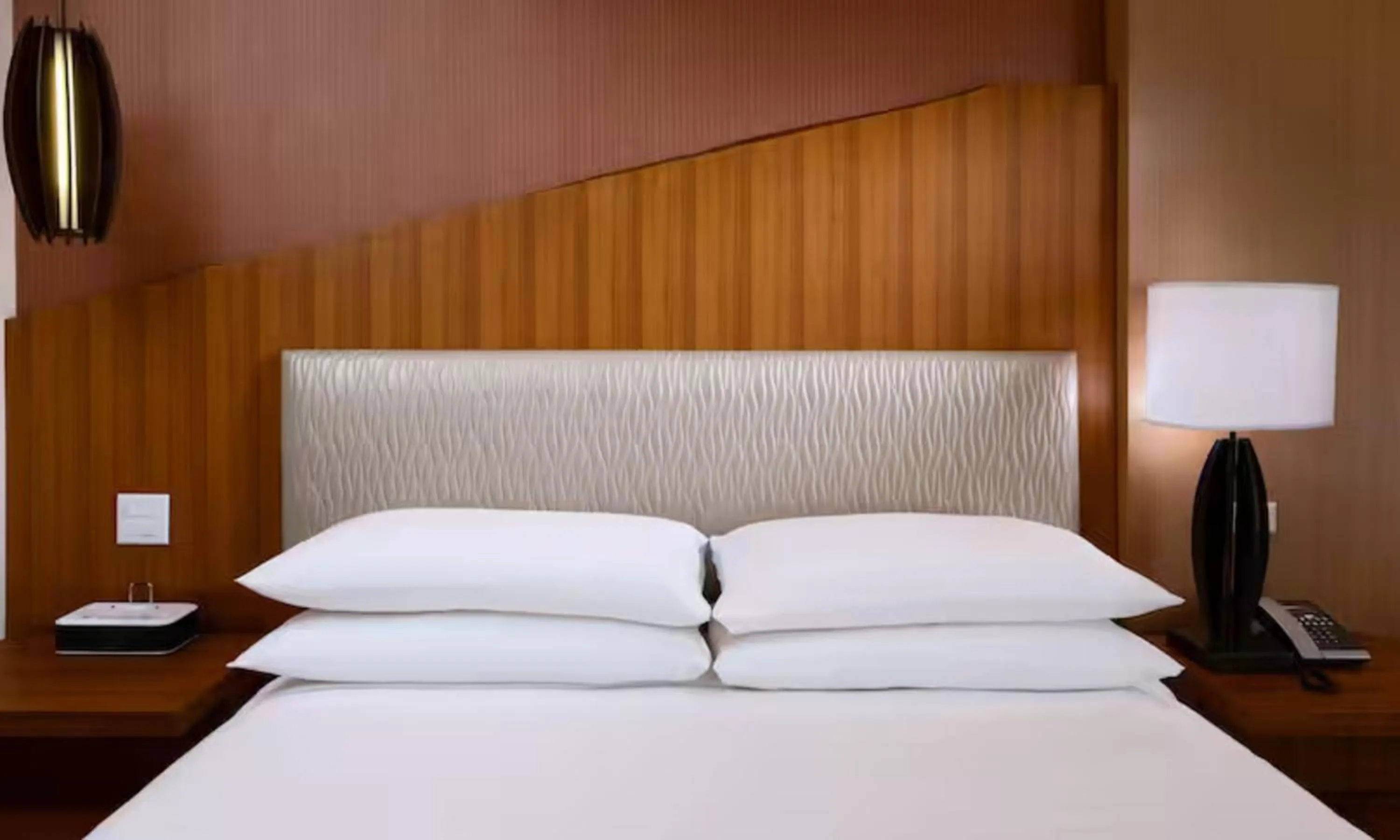 Bed in The Inverness Denver, a Hilton Golf & Spa Resort