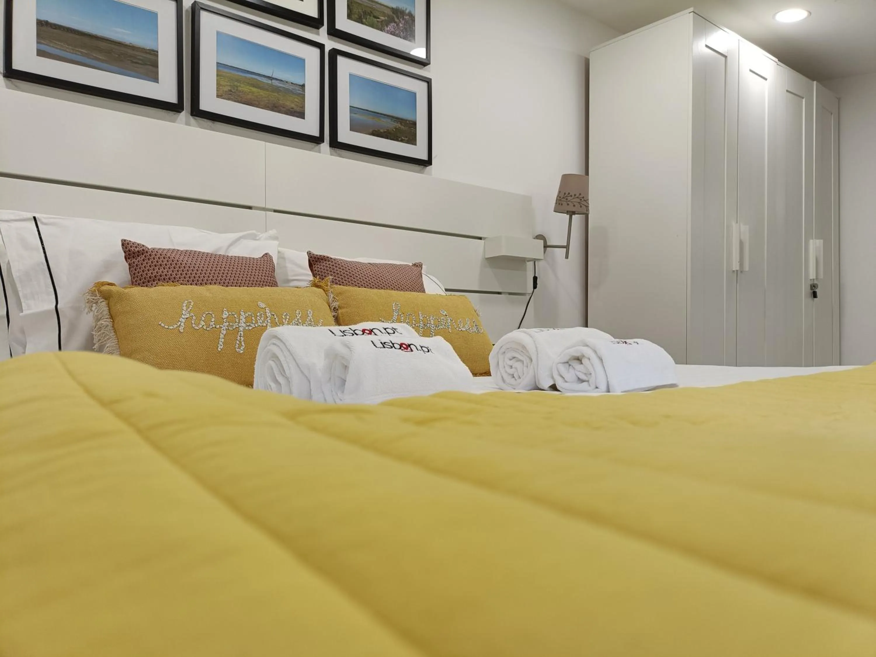 Bed in DoBairro Suites at Merces