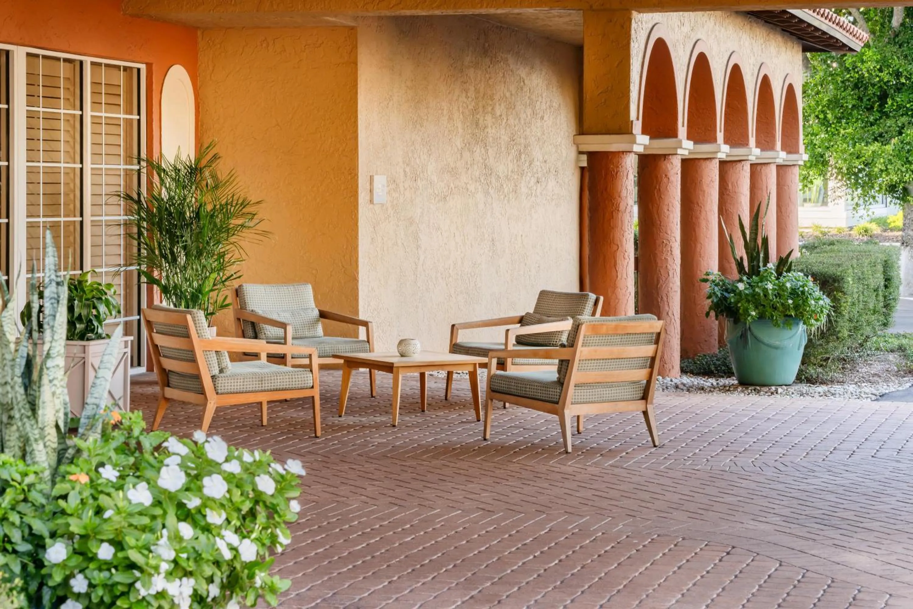 Patio in Inn of Naples, Tapestry Collection by Hilton