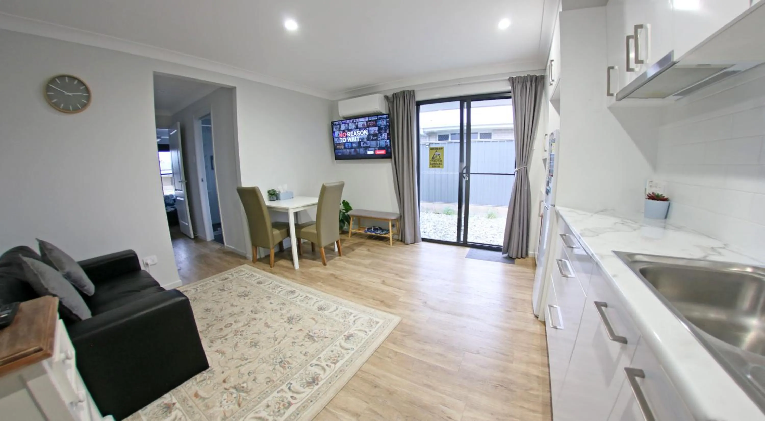 Communal lounge/ TV room in Granny Flat next to golf course