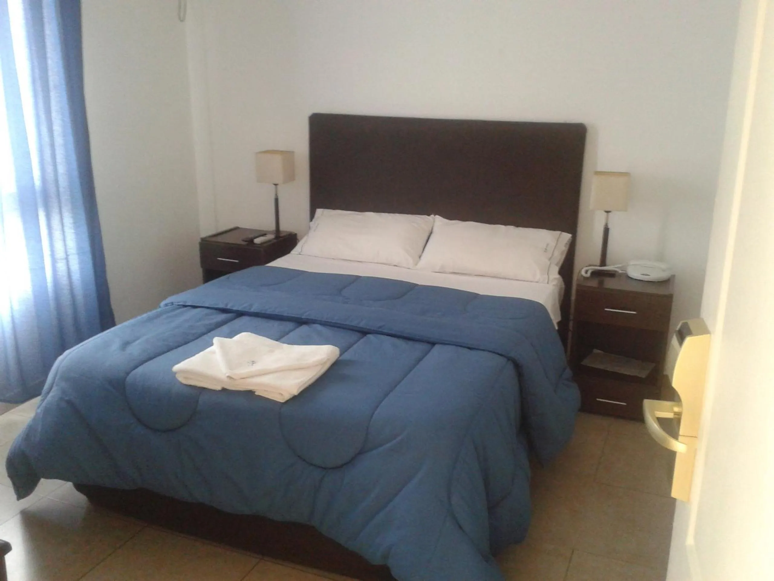 Bed in Morada Suites